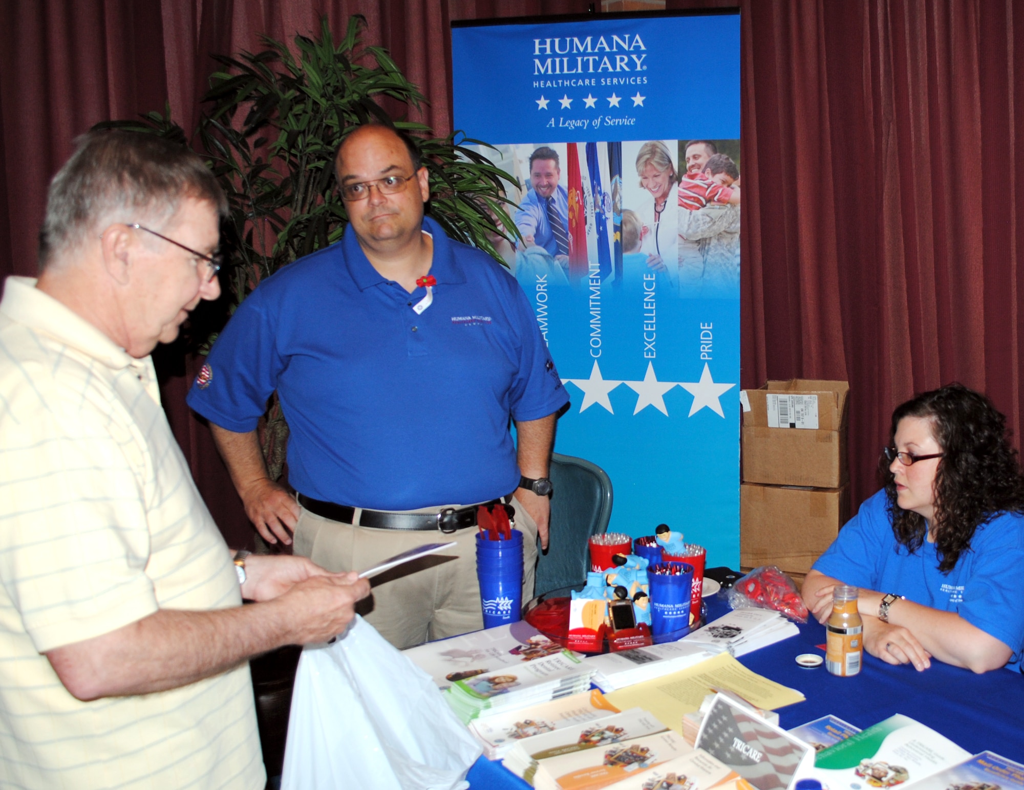 The 71st Medical Group’s TriCare Service Center manager, Richard Shepard, center, and beneficiary services representative, Melissa Beebe, right, discuss available benefits with one of the more than 115 military retirees attending Vance’s 2010 Retiree Appreciation Day held at the Vance Collocated Club, Thursday, June 24. Information about everything from educational opportunities to survivor benefits was available from 33 vendors and a variety of speakers. (U.S. Air Force photo/ Bob Farrell)