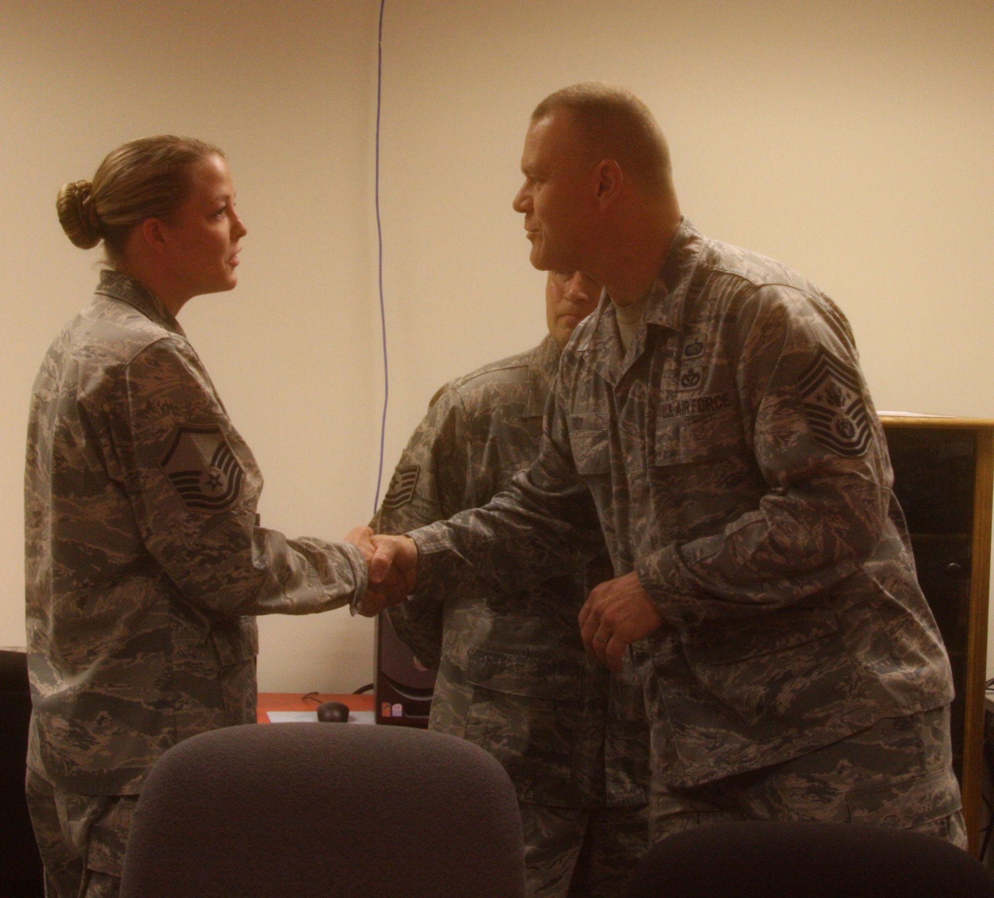 WRIGHT-PATTERSON AIR FORCE BASE, Ohio – Master Sgt. Stephanie Strickland, 445th Aeromedical Evacuation Squadron was coined by Chief Master Sgt. of the Air Force James A. Roy during his visit here June 11 for her outstanding contributions to the wing.  The Chief was visiting Wright-Patterson Air Force Base as part of the “Corona Top” summit held at the base. (U.S. Air Force photo/Stacy Vaughn)