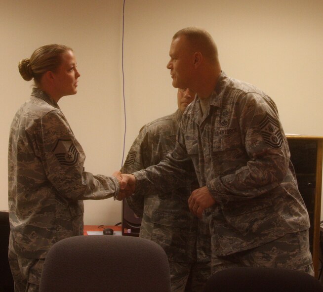 WRIGHT-PATTERSON AIR FORCE BASE, Ohio – Master Sgt. Stephanie Strickland, 445th Aeromedical Evacuation Squadron was coined by Chief Master Sgt. of the Air Force James A. Roy during his visit here June 11 for her outstanding contributions to the wing.  The Chief was visiting Wright-Patterson Air Force Base as part of the “Corona Top” summit held at the base. (U.S. Air Force photo/Stacy Vaughn)