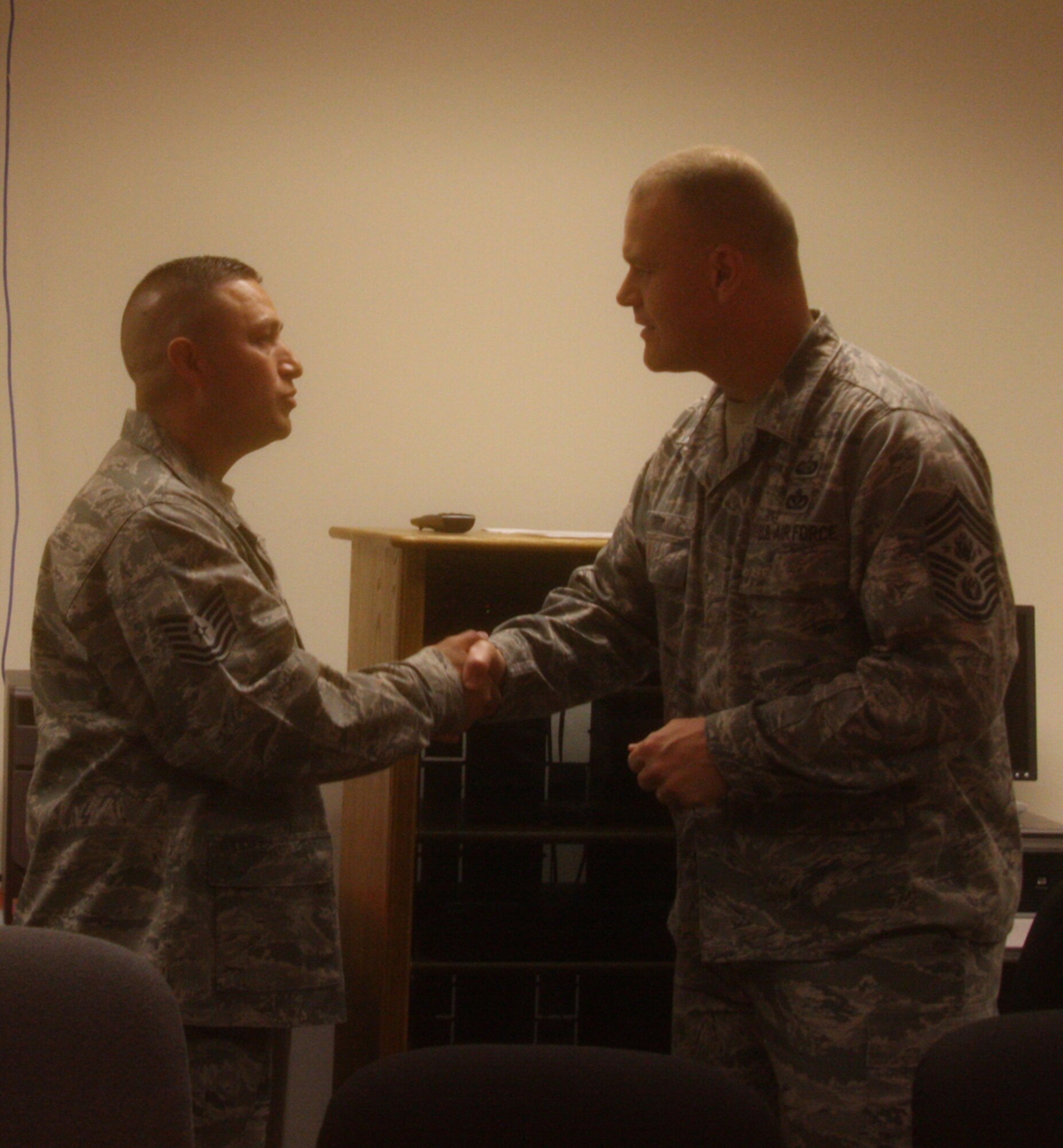 WRIGHT-PATTERSON AIR FORCE BASE, Ohio – Tech. Sgt. Lauro Valles, Jr., 445th Maintenance Group, was coined by Chief Master Sgt. of the Air Force James A. Roy during his visit here June 11 for his outstanding contributions to the wing.  The Chief was visiting Wright-Patterson Air Force Base as part of the “Corona Top” summit held at the base. (U.S. Air Force photo/Stacy Vaughn)
