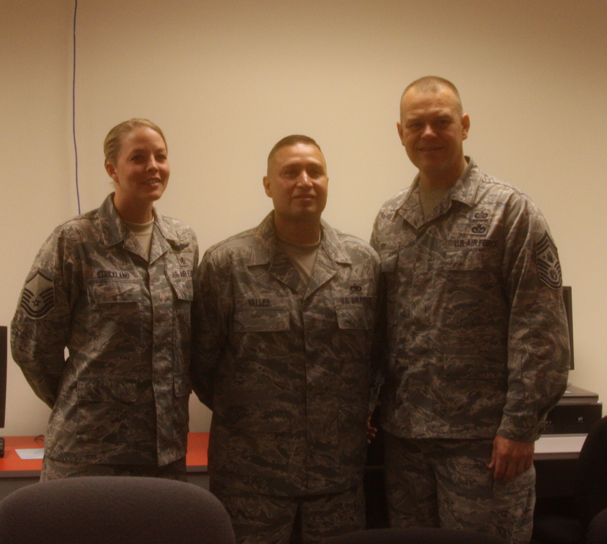 WRIGHT-PATTERSON AIR FORCE BASE, Ohio – Master Sgt. Stephanie Strickland, 445th Aeromedical Evacuation Squadron and Tech. Sgt. Lauro Valles, Jr., 445th Maintenance Group, were both coined by Chief Master Sgt. of the Air Force James A. Roy during his visit here June 11 for their outstanding contributions to the wing.  The Chief was visiting Wright-Patterson Air Force Base as part of the “Corona Top” summit held at the base. (U.S. Air Force photo/Stacy Vaughn)