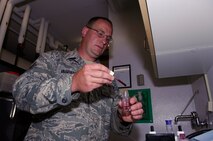 NEAR RYDER, N.D. – Tech. Sgt. Guy Ulshafer, 740th Missile Squadron Echo-01 facility manager site senior, conducts a test to determine the hardness level of the water at missile alert facility E-01 here June 24. The professionalism and hard work of Sergeant Ulshafer played an integral part in the MAF winning the Maj. Gen. M. C. “Tim” Padden Award for best Missile Alert Facilities in Air Force Space Command for 2009. (U.S. Air Force photo by Tech. Sgt. Thomas Dow)