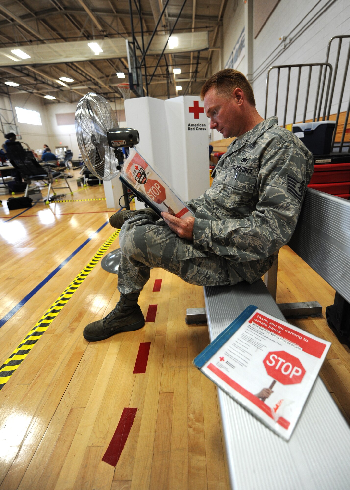 U.S. Air Force Tech. Sgt. Lester Crim reads through an American Red Cross blood donation pamphlet before donating at the Sports and Fitness Center June 23, 2010, at Joint Base Charleston, S.C. The pamphlet walks a donor through the procedure from start to finish and includes information on how the donation process works, any risks involved and what to prepare for prior to donating. Sergeant Crim is a jet engine mechanic with the 315th Maintenance Squadron. (U.S. Air Force photo/Senior Airman Timothy Taylor)
