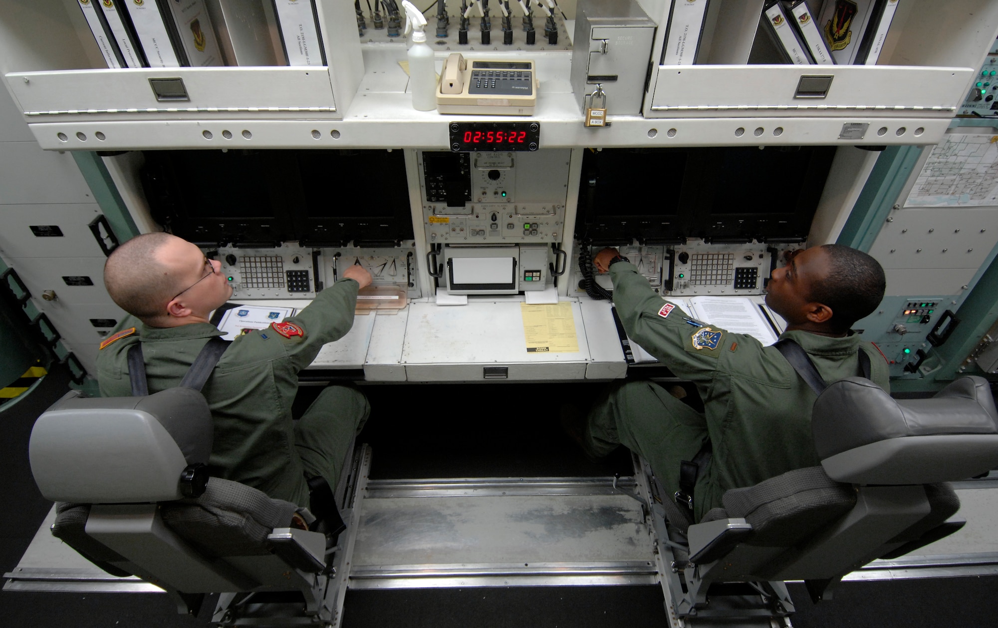 MINOT AIR FORCE BASE, N.D. -- 1st Lt. Jeremy King (left) and 2nd Lt. Glen Jasper (right), both from the 740th Missile Squadron, simulate launching a Minuteman III intercontinental ballistic missile at the missile procedure trainer here Sept. 24, 2009. The professionalism of the 740th MS crew commanders played an integral part in missile alert facility E-01 winning the Maj. Gen. M. C. “Tim” Padden Award for best Missile Alert Facilities in Air Force Space Command for 2009. (U.S. Air Force photo by Senior Airman Matthew Smith)