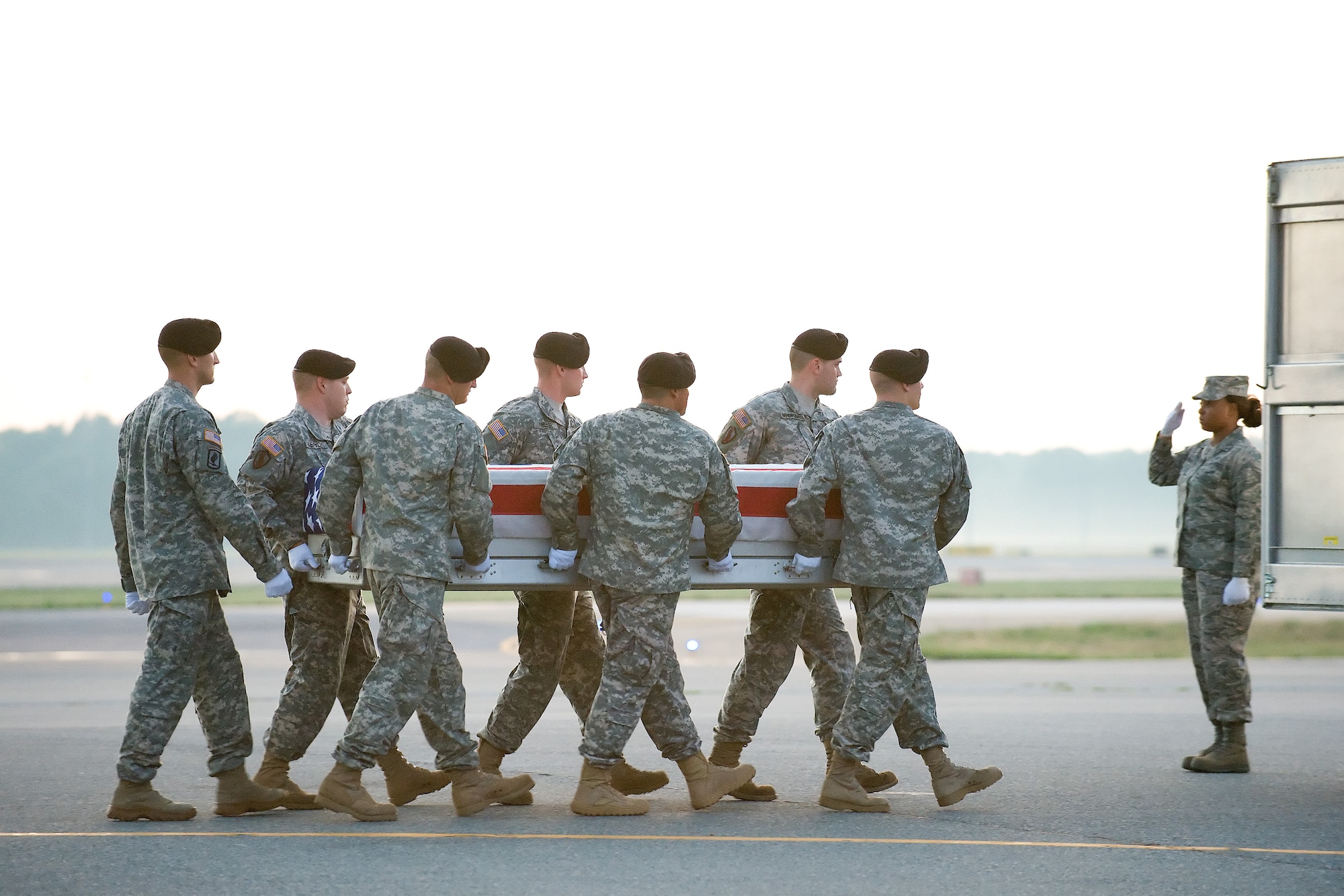 25 June 2010  USAF Photo by Jason Minto.  A U.S. Army carry team transfers the remains of Army PFC Russell E. Madden of Dayton, KY at Dover Air Force Base, Del., June 25, 2010.  