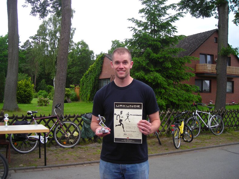WRIGHT-PATTERSON AIR FORCE BASE, Ohio – Senior Airman Shayne Thompson, 445th Logistics Readiness Squadron, won first place in his age group in the Heide Half Marathon in Stude, Germany, June 13 while on annual tour at Ramstein Air Base, Germany.  (Courtesy photo)
