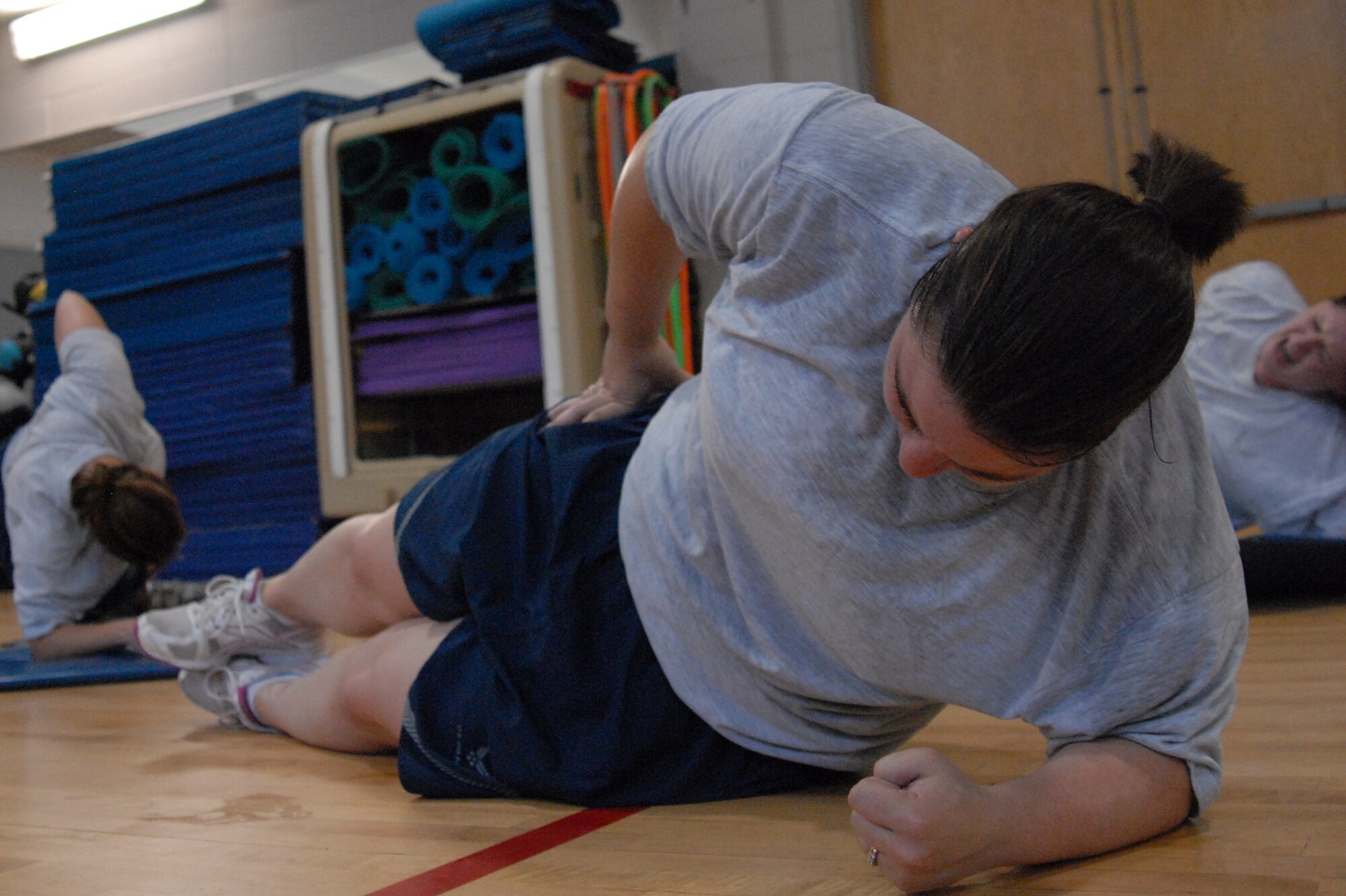 Senior Airman Christina McPheters, 1st Special Operations Maintenance Group, performs an oblique flank during Boot Camp at the Aderholt Fitness Center, Hurlburt Field, Fla., June 24, 2010. The Hurlburt Field Boot Camp, run by the base’s Health and Wellness Center, is a base-unique program that takes Airmen with marginal or failing scores through 80 days of intense physical training. (DoD photo by U.S. Air Force Staff Sgt. Orly N. Tyrell/Released)