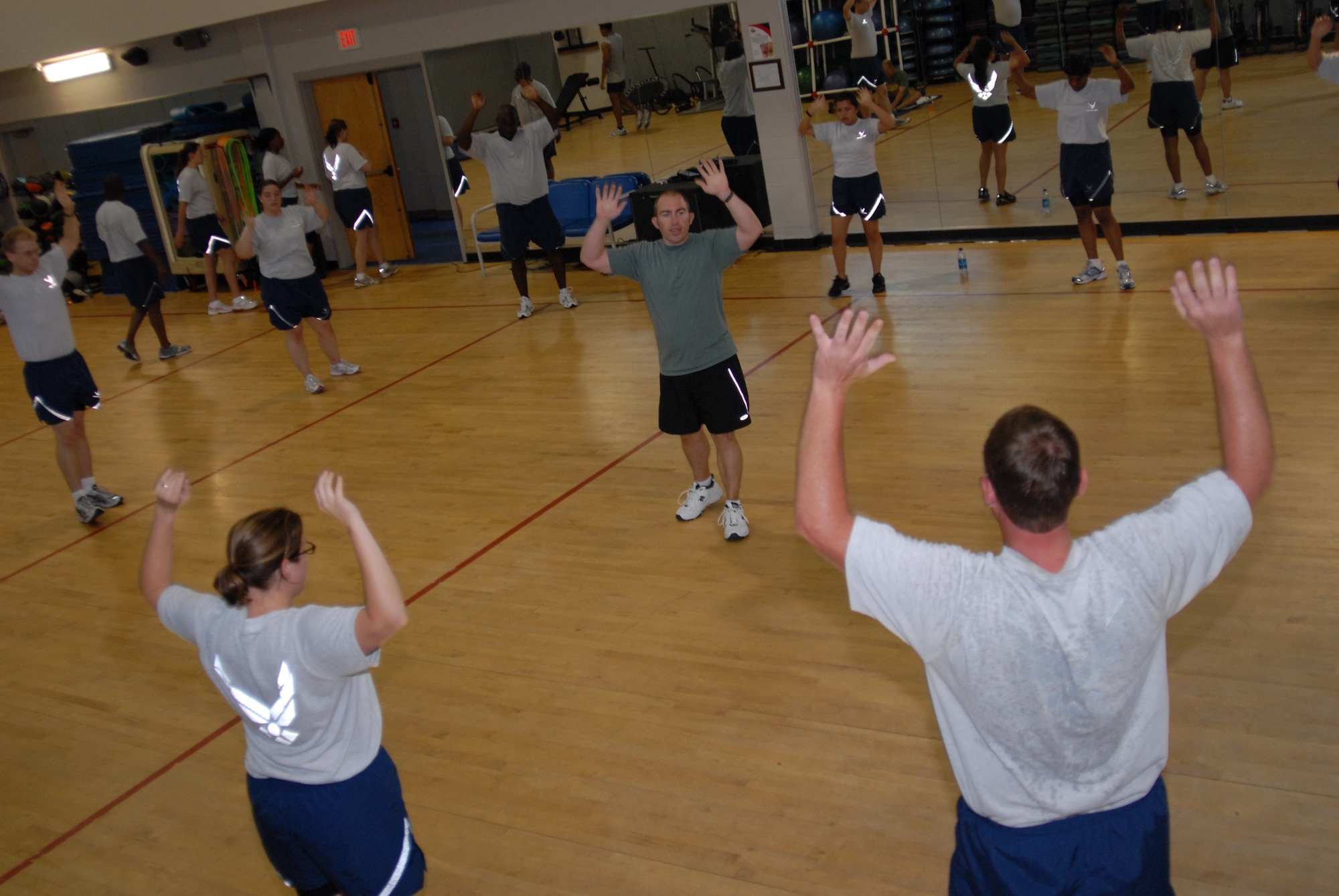 Brent Cowen, an exercise physiologist with Hurlburt Field's Health and Wellness Center, conducts the pyramid exercise during a Boot Camp class at the Aderholt Fitness Center, Hurlburt Field, Fla., June 24, 2010. The Hurlburt Field Boot Camp, run by the base’s Health and Wellness Center, is a base-unique program that takes Airmen with marginal or failing scores through 80 days of intense physical training. (DoD photo by U.S. Air Force Staff Sgt. Orly N. Tyrell/Released)