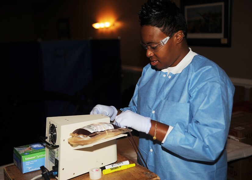 SEYMOUR JOHNSON AIR FORCE BASE, N.C. -- Teresa Medina prepares to test a blood donation before packing it during an Armed Service blood drive at Heritage Hall Community Center June 28, 2010. All donations go through a series of testing for diseases transmittable through a blood transfusion, including HIV, malaria and viral hepatitis before sending into the war zone. Ms. Medina, a Fort Bragg Blood Donor Center phlebotomist, hails from Fayetteville. (U.S. Air Force photo/Senior Airman Ciara Wymbs)
