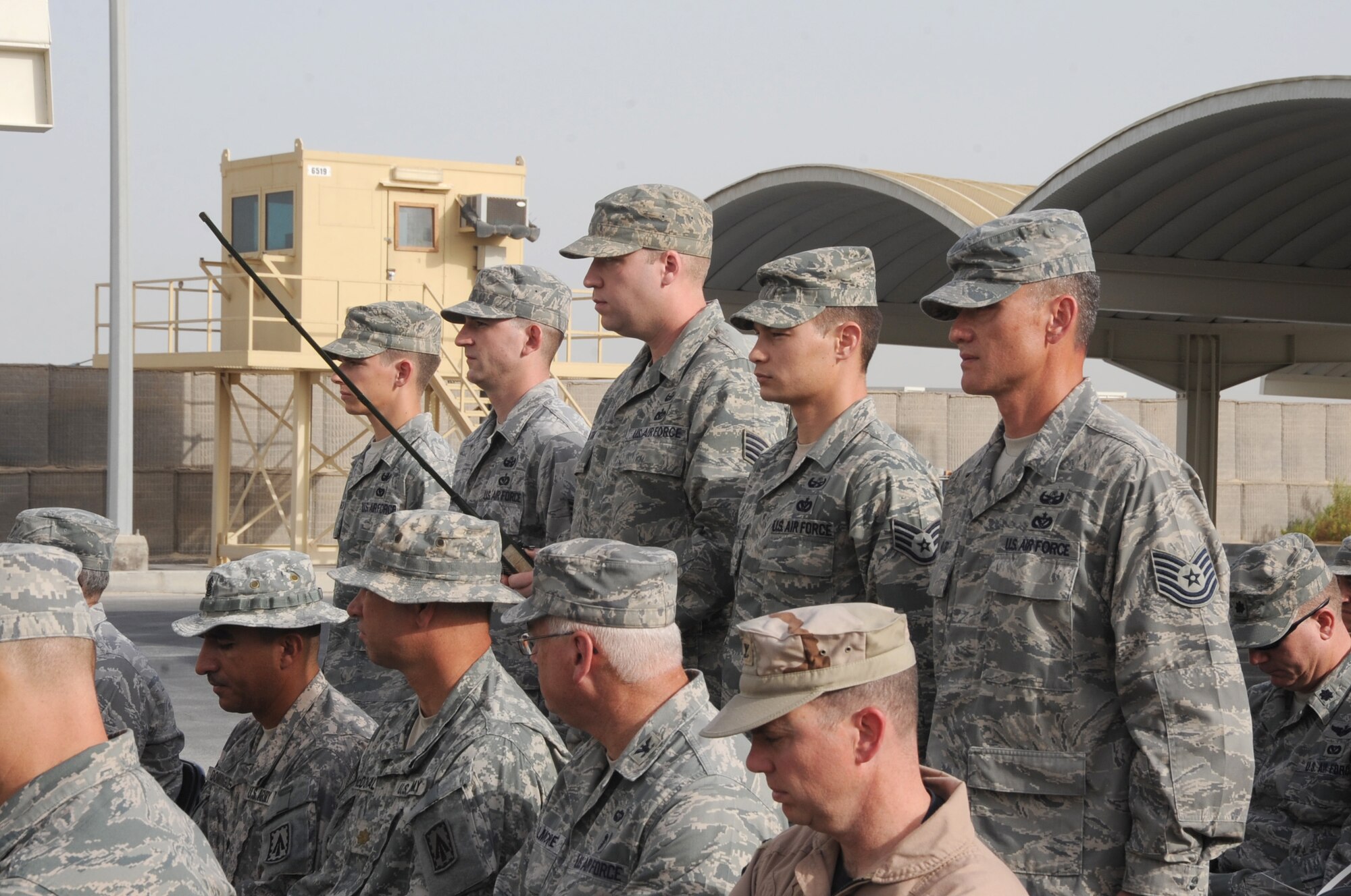 Members of the 380th Expeditionary Civil Engineer Squadron perform a final roll call during a building dedication ceremony June 27 at an undisclosed base in Southwest Asia. The building was named in honor of Tech. Sgt. Anthony C. Campbell, Jr., a EOD technician who was killed in action by an improvised explosive device while forward deployed to Afghanistan. (U.S. Air Force photo/ Tech. Sgt. April Wickes)