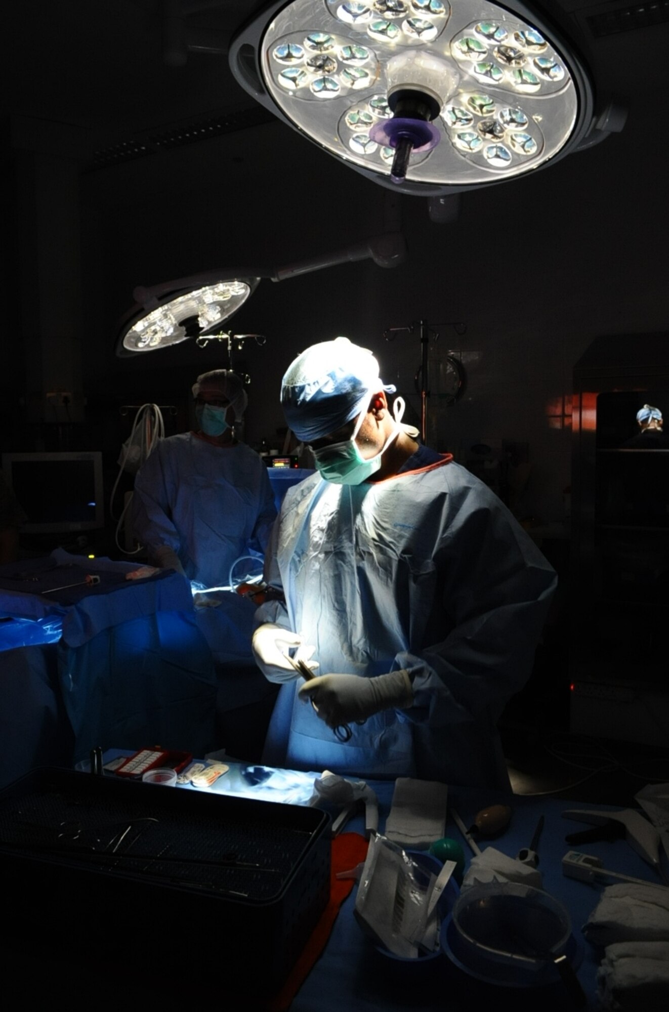 Staff Sgt. Jeron Lowery, 379th Expeditionary Medical Group surgery technician, cleans and prepares medical equipment for surgeons during a hernia surgery at an undisclosed location in Southwest Asia June 9, 2010. (U.S. Air Force photo by Senior Airman Kasey Zickmund)[RELEASED]