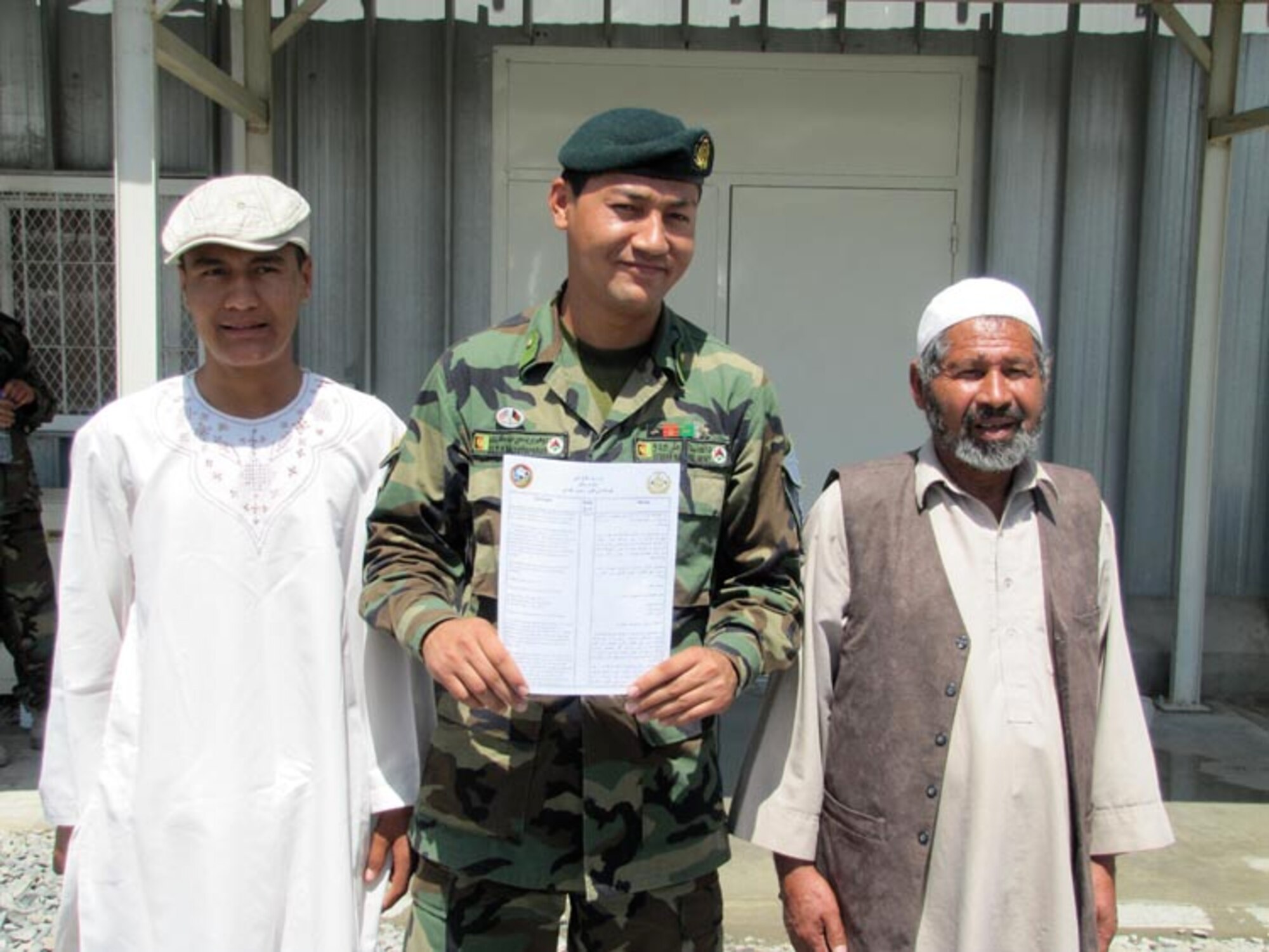 Afghan National Army Air Force 2nd Lieutenant Said Muzafarshah Anwari signs his service commitment to attend Undergraduate Pilot Training in the United States on Jun. 20, 2010 at the Afghan National Army Air Force base in Kabul, Afghanistan (U.S. Navy photo by Mass Communications Specialist First Class Elizabeth Burke/RELEASED).