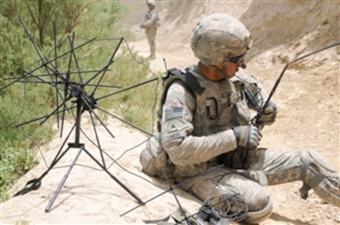 U.S. Army Sgt. Anthony Limon, from White Tank, 2nd Platoon, Delta Company, 1st Battalion, 4th Infantry Regiment, sets up a tactical satellite system while on patrol in Zabul province, Afghanistan, on June 25, 2010.  