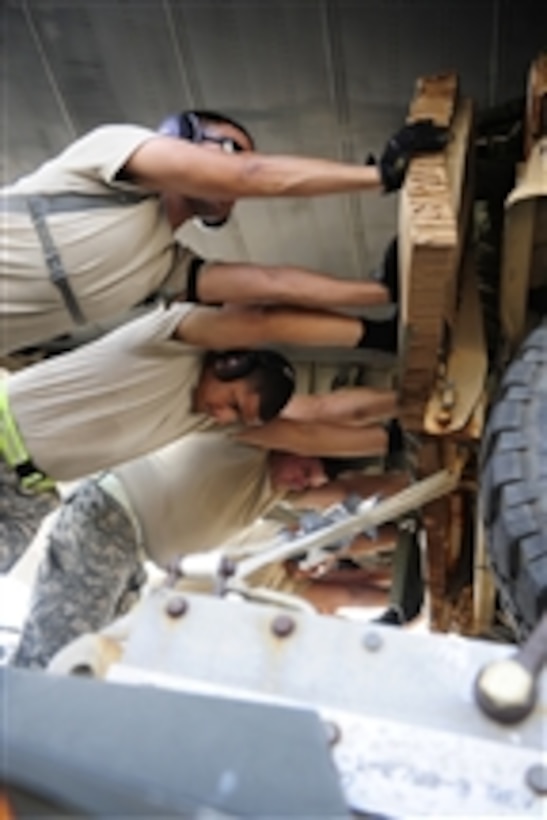 U.S. Air Force airmen from the 3rd Aerial Port Squadron load a C-130 Hercules cargo aircraft with a Humvee on a pallet configured for aerial insertion in support of a joint forcible entry exercise at Pope Air Force Base, N.C., on June 23, 2010.  