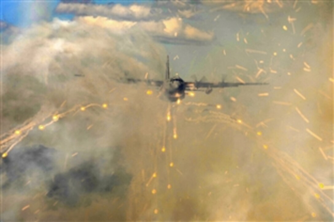 A C-130H Hercules aircraft deploys flares over Alaska as part of a training exercise during Red Flag Alaska 10-3, Eielson Air Force Base, Alaska, June 23, 2010. The C-130 crew is assigned to Yakota Air Base, Japan.