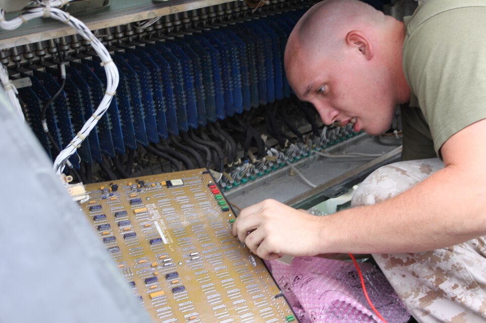 Cpl. Zechariah Elliott, an air traffic control radar maintenance specialist, works on a radar antenna at Marine Air Control Squadron 4 Detachment B here June 29. MACS-4 Det. B provides Iwakuni with all-weather, non-radar and radar approach, departure and en route air traffic control services to friendly aircraft.