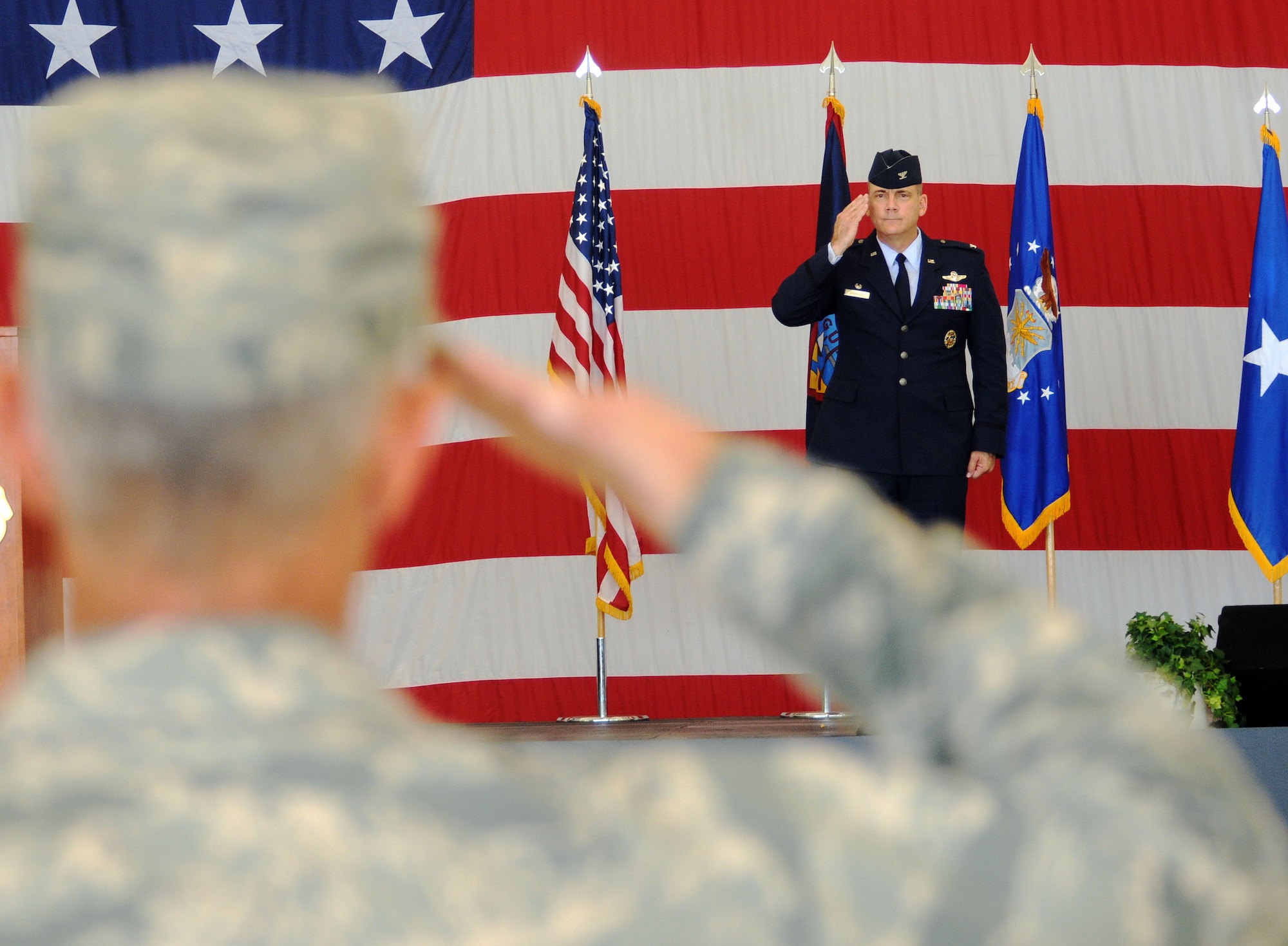 ANDERSEN AIR FORCE BASE, Guam - Colonel Tod Fingal, 36th Wing Vice Commander, renders the wing's initial salute to new commander, Brig. Gen. (select) John Doucette here June 25. Brig. Gen. (select) Doucette assumed command of the 36th Wing after Brig. Gen. Philip Ruhlman, who served for two years as wing commander, relinquished command. (U.S. Air Force photo by Airman Julian North)