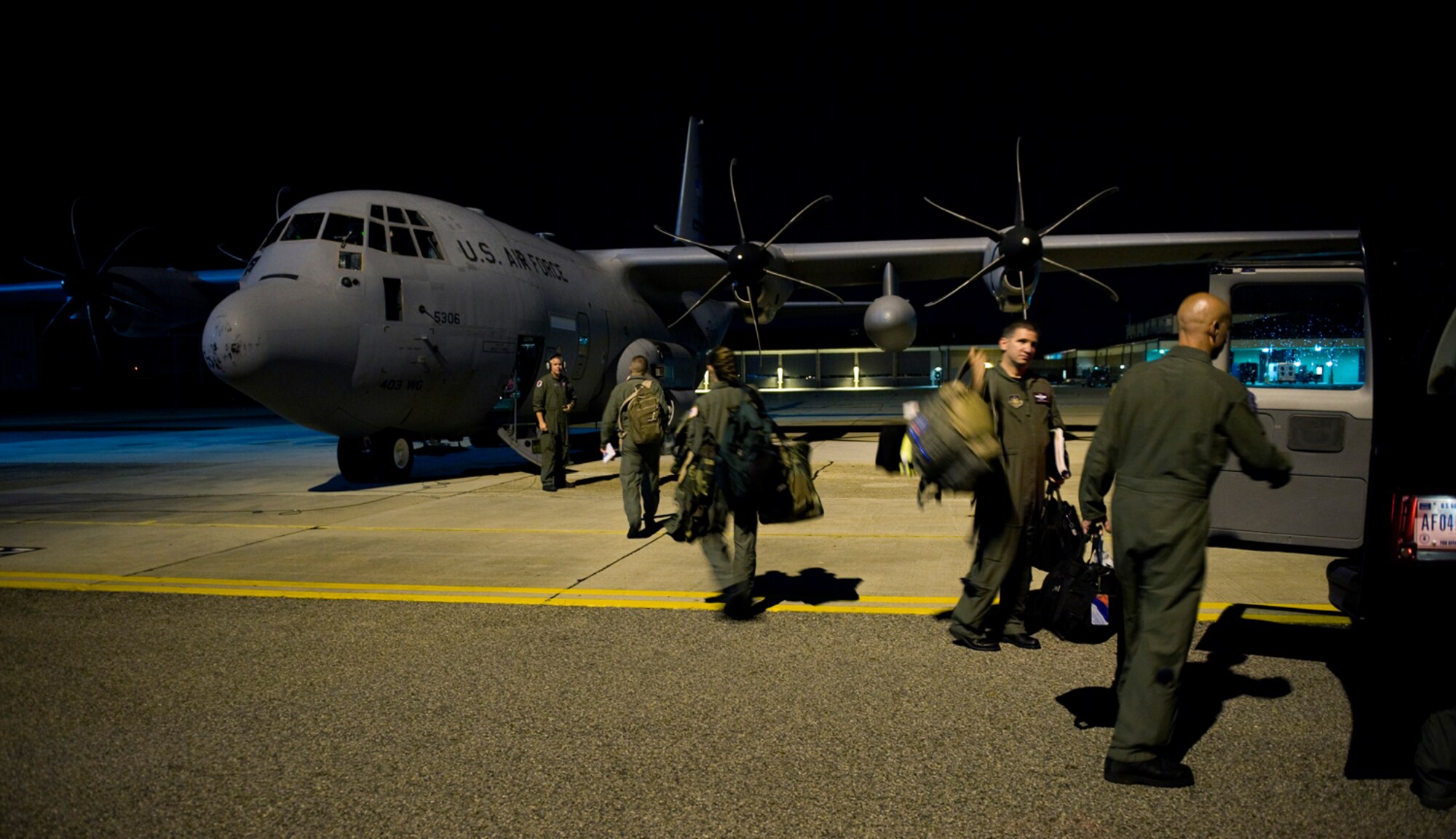 A Hurricane Hunter crew from the 53rd Weather Reconnaissance Squadron at Keesler Air Force Base, Miss, loads a WC-130J Hercules aircraft for a late night mission into Hurricane Alex June 29, 2010.  (U.S. Air Force photo/Master Sgt. Jack Braden)