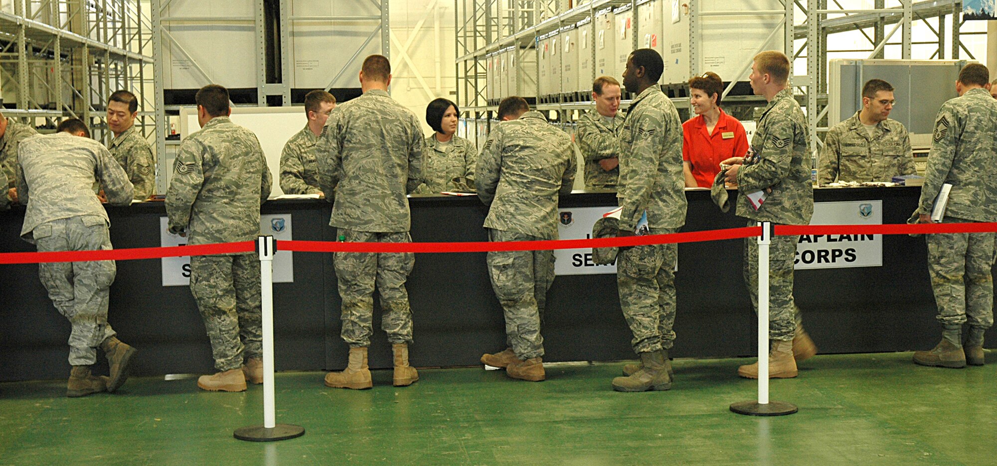 Reserve and active-duty Airmen go through the deployment processing line June 29 at Joint Base Lewis-McChord, McChord Field, Wash., in preparation for upcoming deployments.  More than 25 Reserve maintenance Airmen will deploy early in July to take up the mission from active-duty McChord Field Airmen in Southwest Asia. (U.S. Air Force photo/Sandra Pishner)