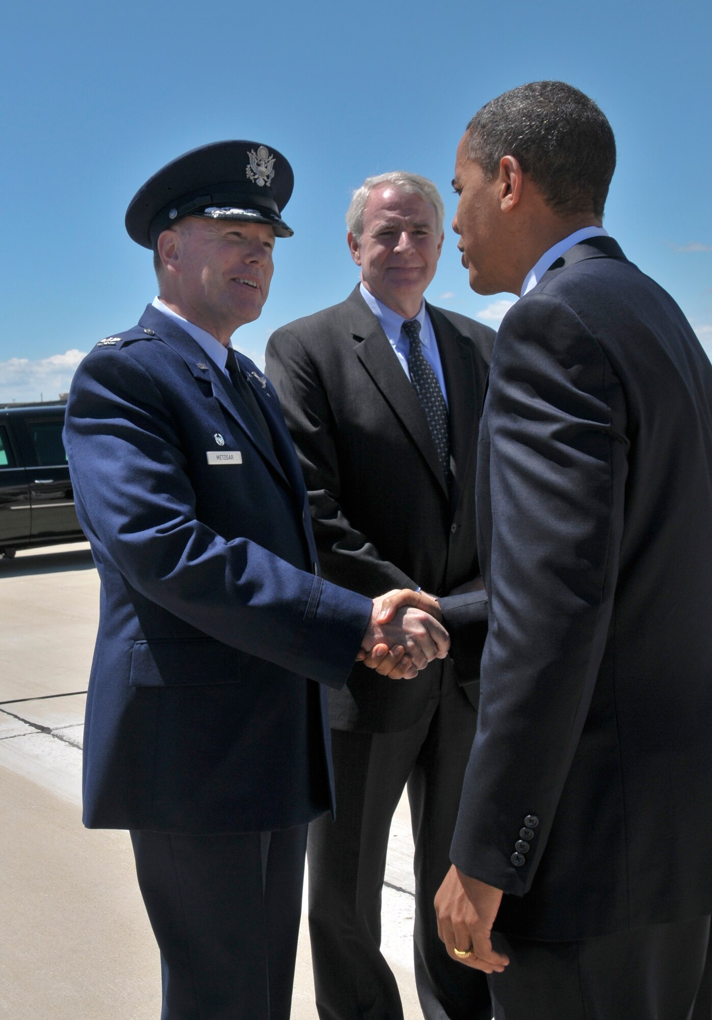 Col Ted Metzgar, Commander of the 128th Air Refueling Wing, Wisconsin Air National Guard and Milwaukee Mayor Tom Barrett greet President Barack Obama upon his arrival in Milwaukee  June 30, 2010. The President landed at the 128th in route  to a town hall meeting in Racine Wisconsin. (U.S. Air Force Photo by SMSgt Jeff Rohloff/released)