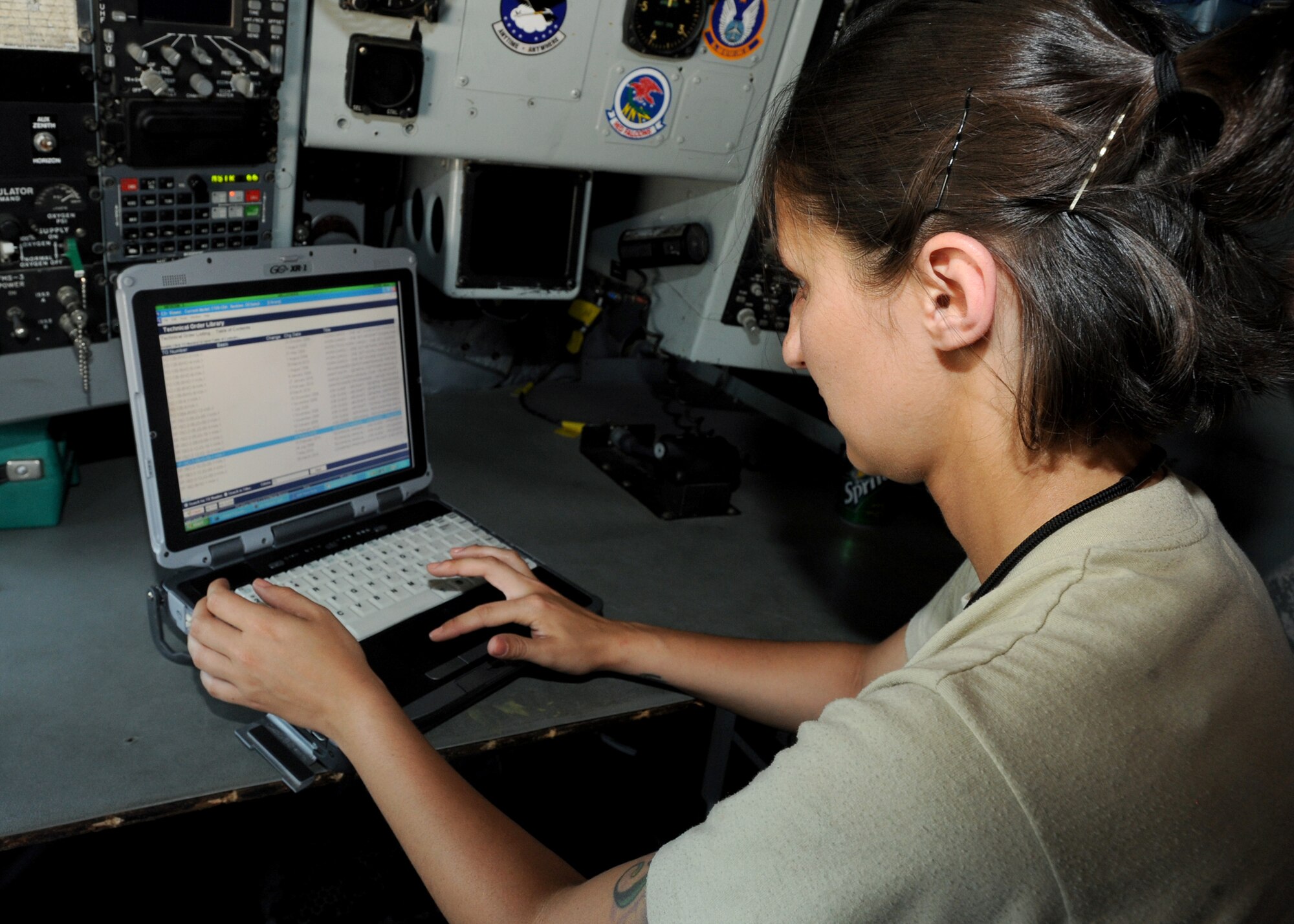 Senior Airman Christine Lea, 22nd Aircraft Maintenance Squadron instrument and flight control technician, browses avionics system maintenance technical orders, June 3, 2010, McConnell Air Force Base, Kan.  Digitalized technical orders allow the maintenance group to have the most accurate and up-to-date information distributed electronically in the least amount of time.  TOs are constantly updated to prevent downtime for maintenance, increasing operational readiness.  (U.S. Air Force photo/Airman 1st Class Andrea Salazar)