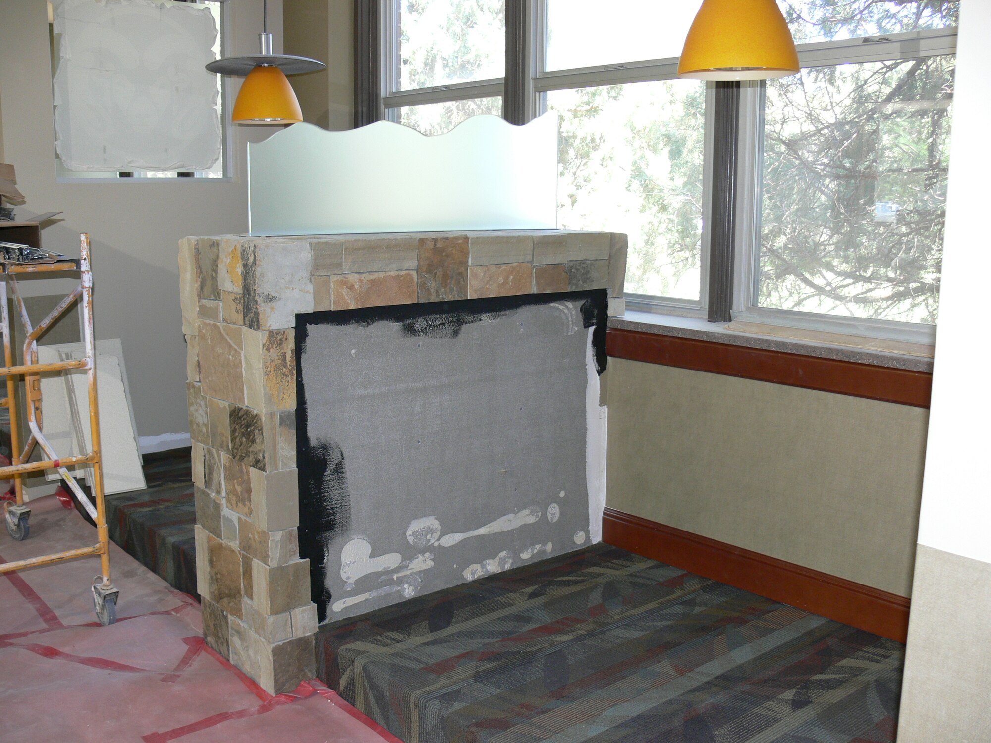 Renovations are ongoing at the Aragon Dining Facility. The facility is expected to reopen Aug. 1; one half of the facility features a Colorado bar scene, with stone finish, etched glass and high bar stools and tables. This sports side of the facility will also have six televisions. The $1.8 million renovation project also includes a new disabled-accessible doorway, a new entrance, new restroom facilities and a new heating, ventilating and air conditioning unit. (U.S. Air Force photo/Monica Mendoza)