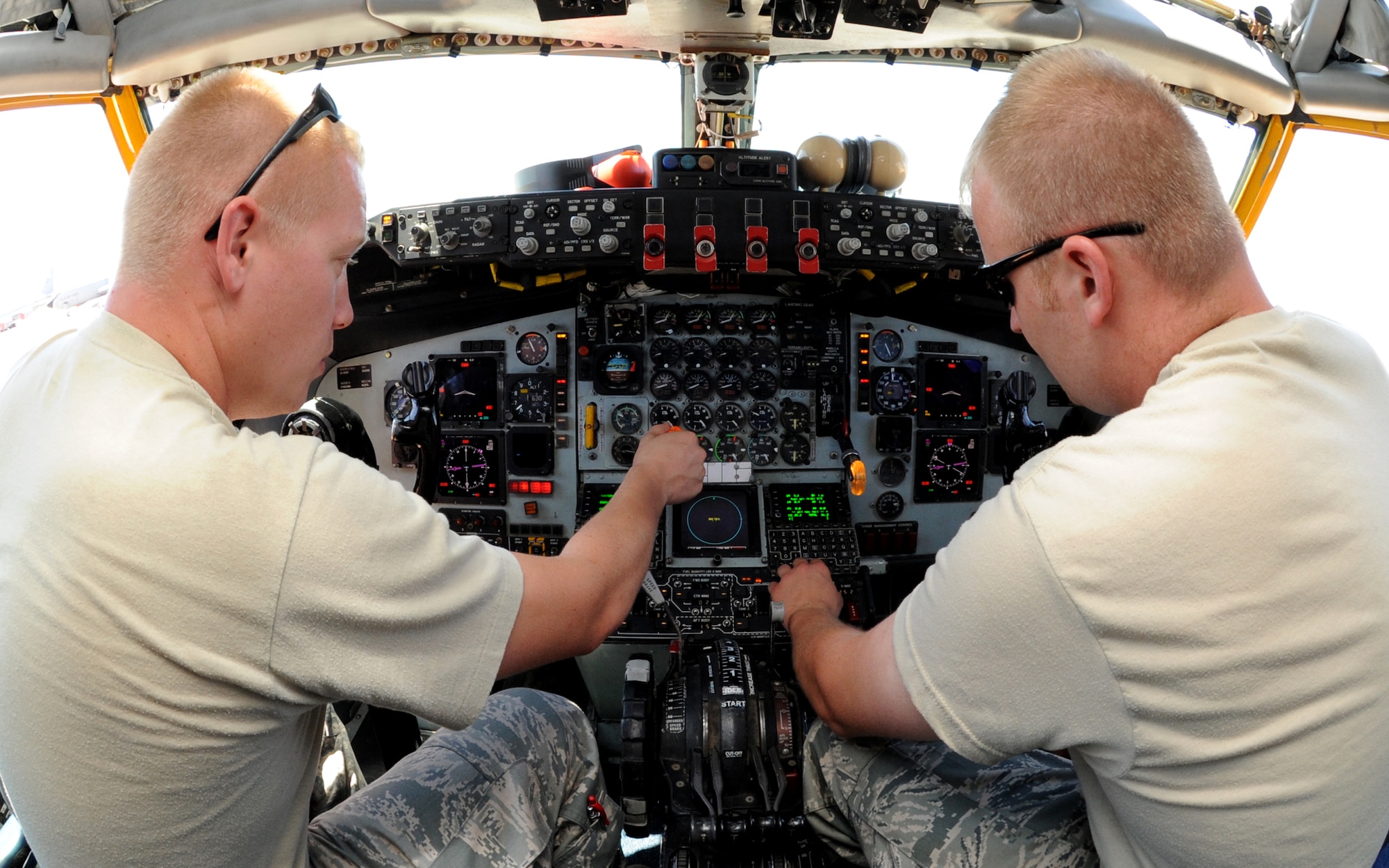 Staff Sgt. Shane Klinkosh, 22nd Aircraft Maintenance Squadron, and Staff Sgt. Joshua Stokes, 185th Air National Guard, instrument and flight control technicians, check a fuel gage flow indicator inside a KC-135 Stratotanker, June 3, 2010, McConnell Air Force Base, Kan.  The fuel flow indicators are replaced every two weeks and must be fully functional for pre and post-flight tests.  The 22nd Maintenance Squadron provides maintenance for the 63 assigned KC-135 aircraft assigned to the wing.  (U.S. Air Force photo/Airman 1st Class Andrea Salazar)
