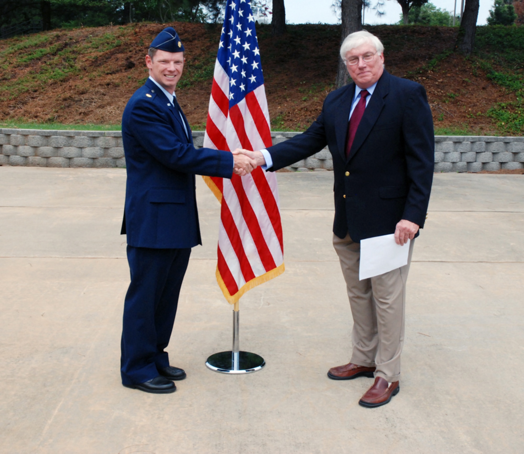 Maj. Robert K. McGhee was sworn in to the Air Force Reserves today by his father, Col. Barton McGhee (retired) at the Prisoner of War/Missing in Action Memorial Park here. (U.S. Air Force Photo by Travon Dennis)