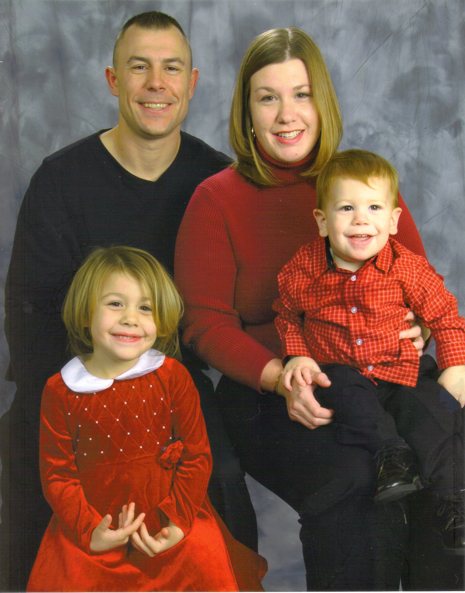 (From top to bottom, left to right) Staff Sgt. Louis Flint, III, 22nd Civil Engineer Squadron domestic engineer, his wife Melissa, homemaker and key spouse member, Lily, 6, and Louie, 3 earned the McConnell Year of the Air Force Family Spotlight award. (courtesy photo)