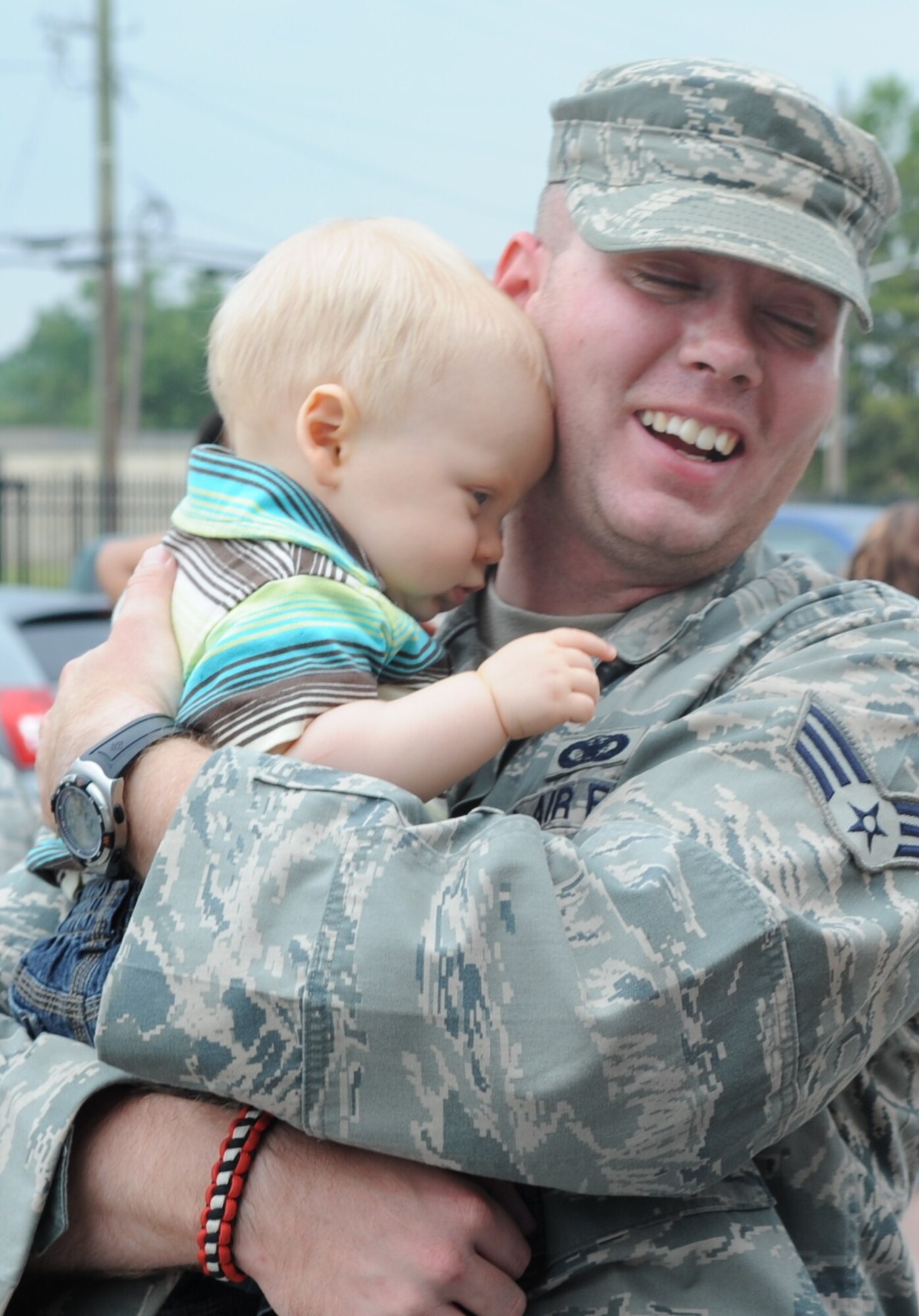 SEYMOUR JOHNSONAIR FORCE BASE, N.C. – Staff Sgt. Nate Buck hugs his son, Maddox, after returning from a deployment to Joint Base Balad, Iraq, June 30, 2010. When Sergeant Buck, 4th Security Forces Squadron desk sergeant, left to support Operation Iraqi Freedom six months ago his son was 11-weeks old. (U.S. Air Force photo/Tech. Sgt. Tammie Moore)