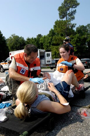 An Airman from Joint Base Charleston plays the role of a pregnant casualty during a mass casualty exercise on Joint Base Charleston, S.C., June 25, 2010. The Airman simulated giving premature birth to a 7-month-old baby following the explosion of a bomb. (U.S. Air Force Photo/Airman 1st Class Lauren Main)
