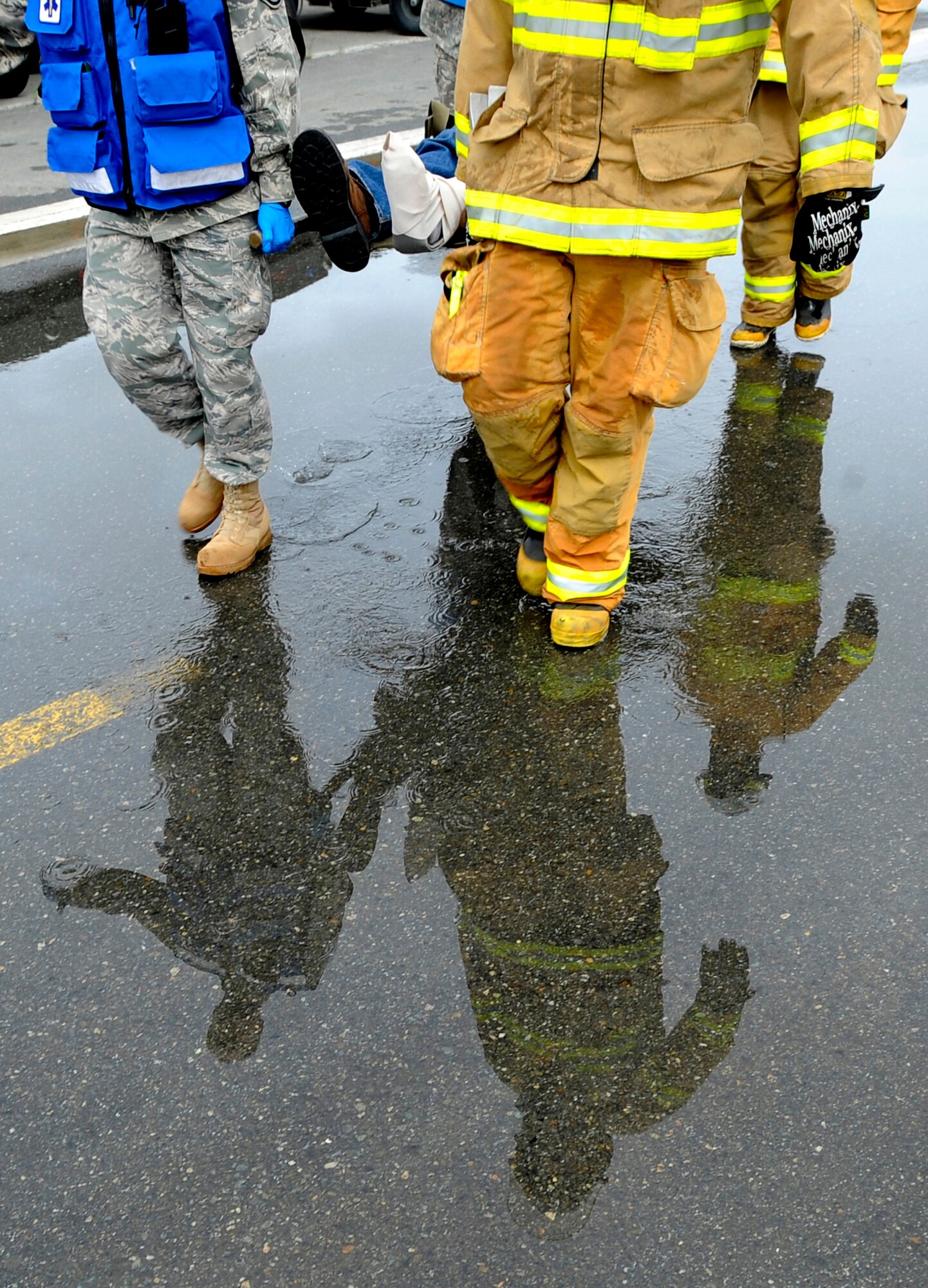 A simulated crash victim is evacuated during an emergency management exercise at Joint Base Elmendorf-Richardson, June 29.  The exercise evaluated the base's ability to handle a large scale aircraft incident in preparation for the upcoming air show, Arctic Thunder 2010, July 31 and Aug. 1. (U.S. Air Force photo/Staff Sgt. Brian Ferguson)