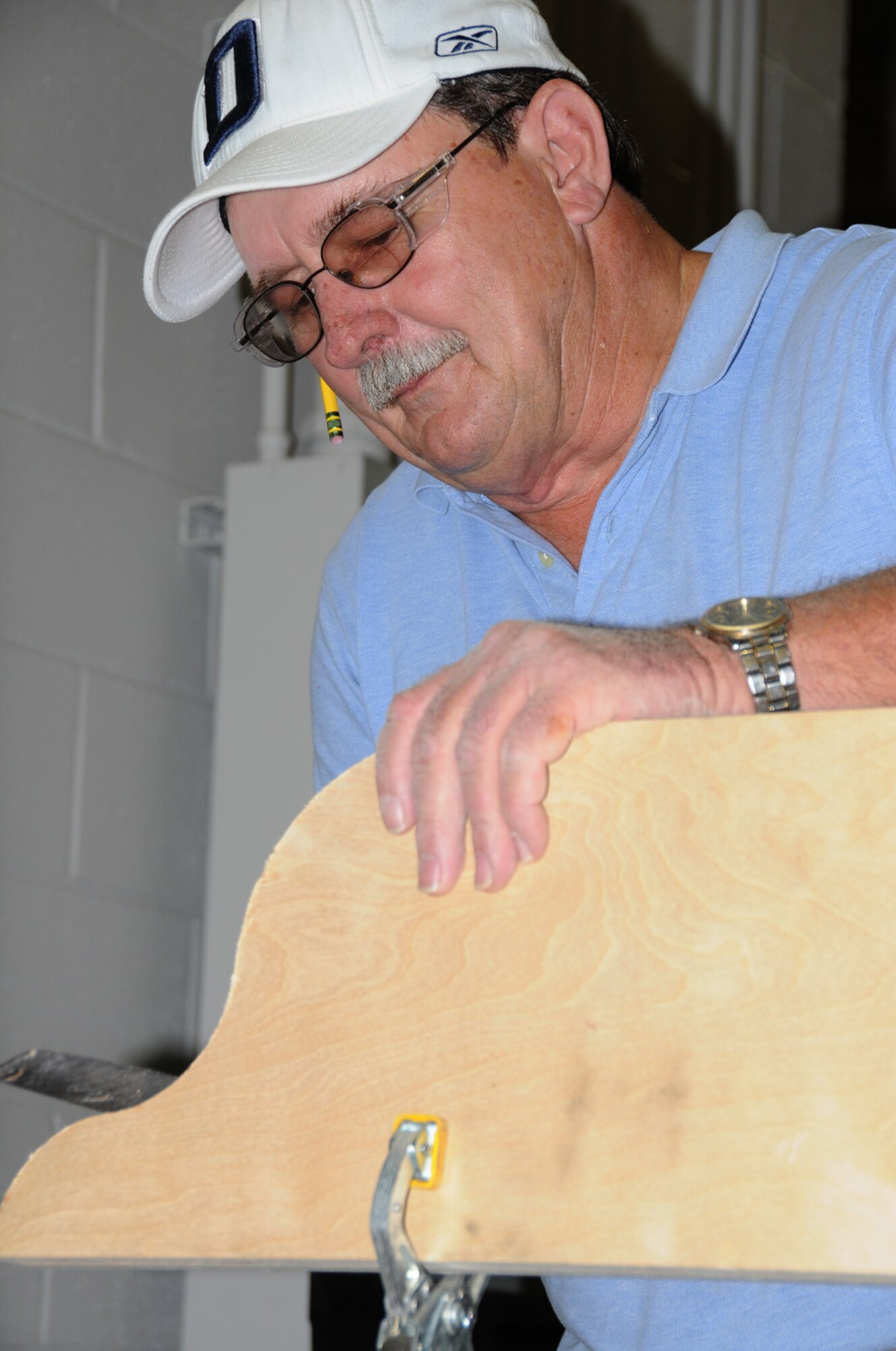 Woodcrafter Gerald Black builds a personal protective equipment cabinet.  (U.S. Air Force photo by Kemberly Groue)