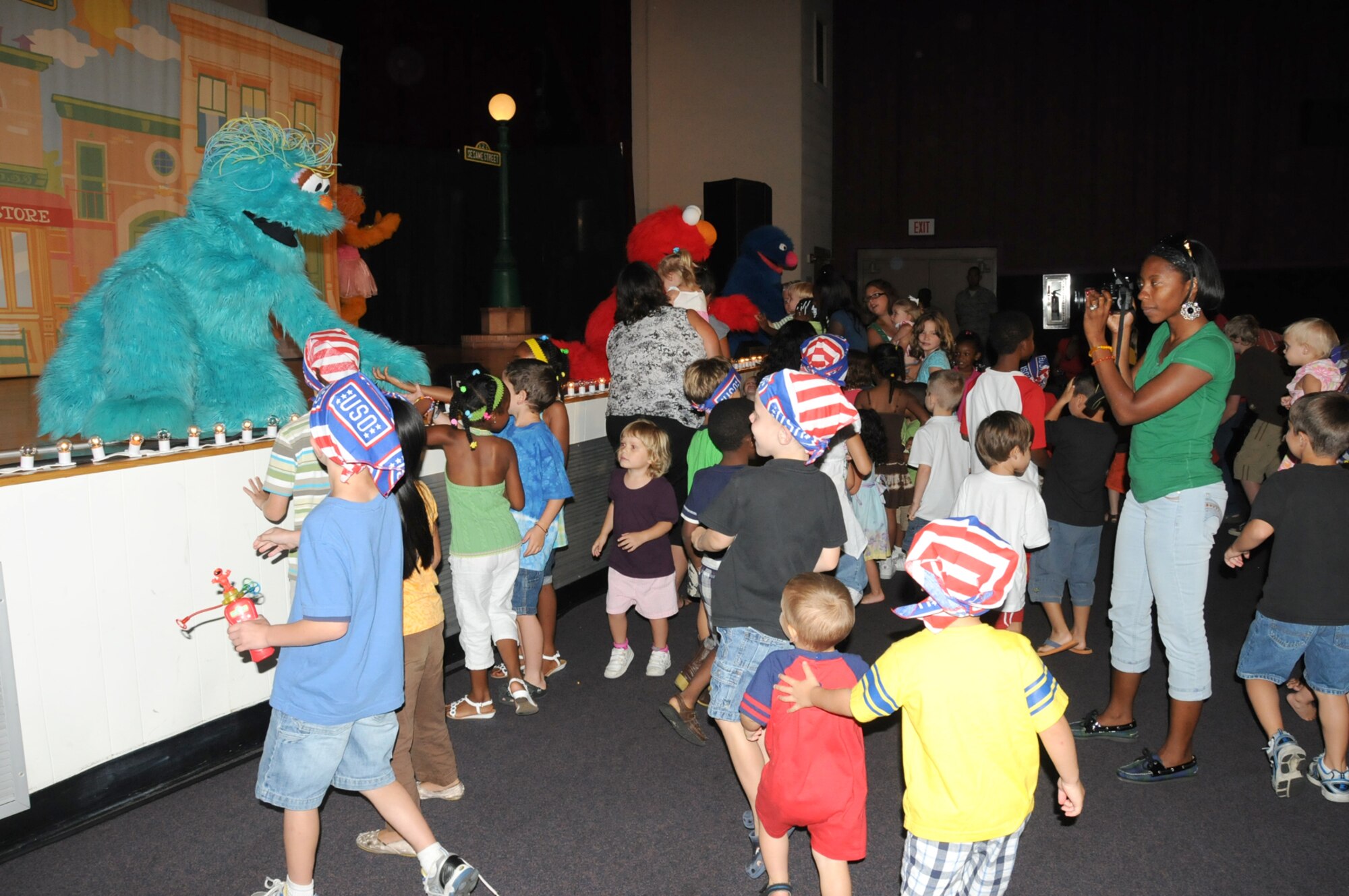 Keesler kids storm the Welch Auditorium stage after one of the two June 24 performances.  (U.S. Air Force photo by Kemberly Groue)