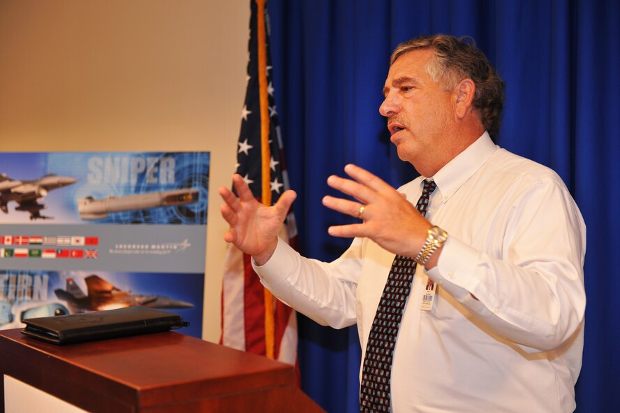 Marty Hutchinson, 571st Combat Sustainment Squadron director, speaks during a ribbon-cutting ceremony June 24 for the newly-opened Fixed-Wing Targeting Depot in Bldg. 640. The ceremony commemorated Lockheed Martin Missiles and Fire Control and the 402nd Maintenance Squadron's move to the new space.
Formerly known as the World Wide LANTIRN Depot, the Fixed Wing Targeting Depot is responsible for providing depot-level repair support and logistics services to domestic and international LANTIRN navigation and targeting pods and U.S. Air Force Sniper Advanced Targeting Pods.
The new facility provides an additional 500 square feet of space and is flexible and expandable to meet current and future business needs. U. S. Air Force photo by Gary Cutrell