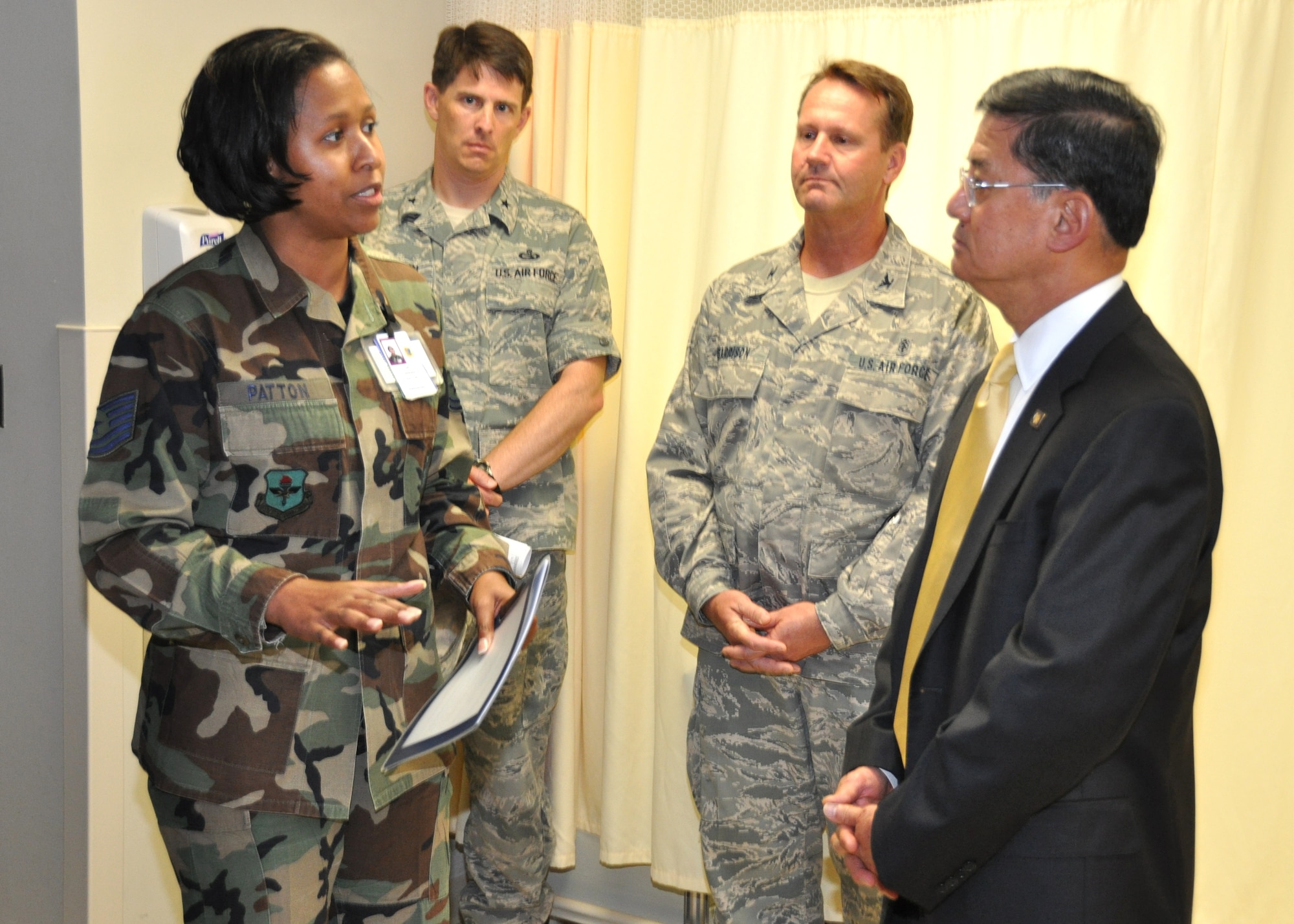 Tech. Sgt. Afrika Patton, 81st Medical Operations Squadron magnetic resonance imaging technologist, talks with Secretary of Veterans Affairs Eric Shinseki during a visit to Keesler June 24.  Sergeant Patton explained how the diagnostic imaging flight implements one of several joint initiatives between the VA and Department of Defense, specifically the 81st Medical Group Hospital.  Brig. Gen. Ian Dickinson, left background, 81st Training Wing commander, and Col. David Garrison, 81st MDG deputy commander, accompanied Secretary Shinseki during his visit.  The secretary also visited the hospital’s new radiation/oncology clinic, viewed construction of the hospital’s new inpatient tower and was briefed on cardiovascular procedures available to veterans. (U.S. Air Force photo by Steve Pivnick)