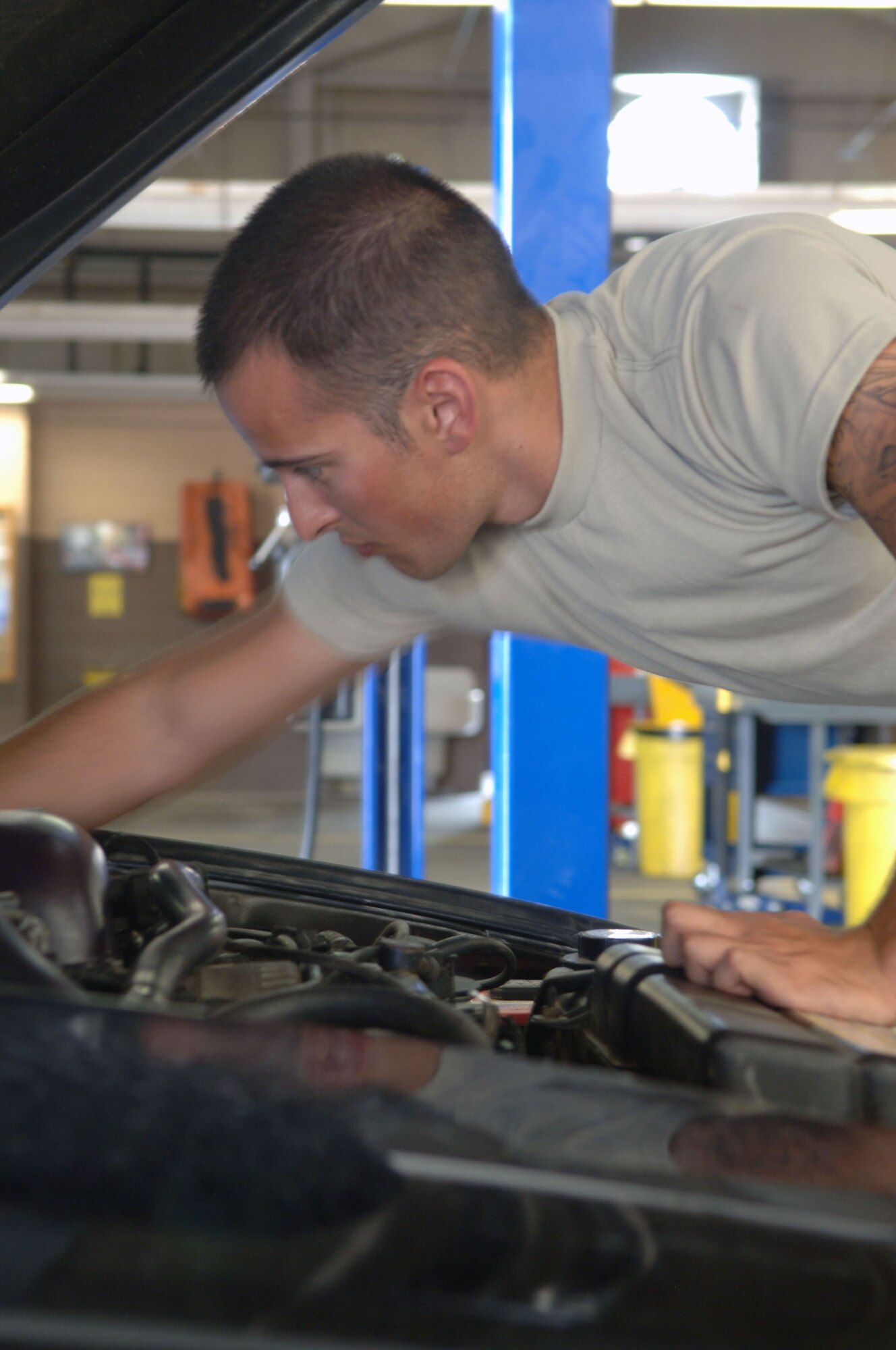 HOLLOMAN AIR FORCE BASE, N.M. -- Airman 1st Class Chad Donovan, 849th Aircraft Maintenance Squadron, works on his vehicle at the Auto Hobby Shop, June 29, 2010. Airman Donovan is a frequent visitor and utilizes the equipment often since his arrival at Holloman. (U.S. Air Force photo by Airman 1st Class Siuta Ika / Released)