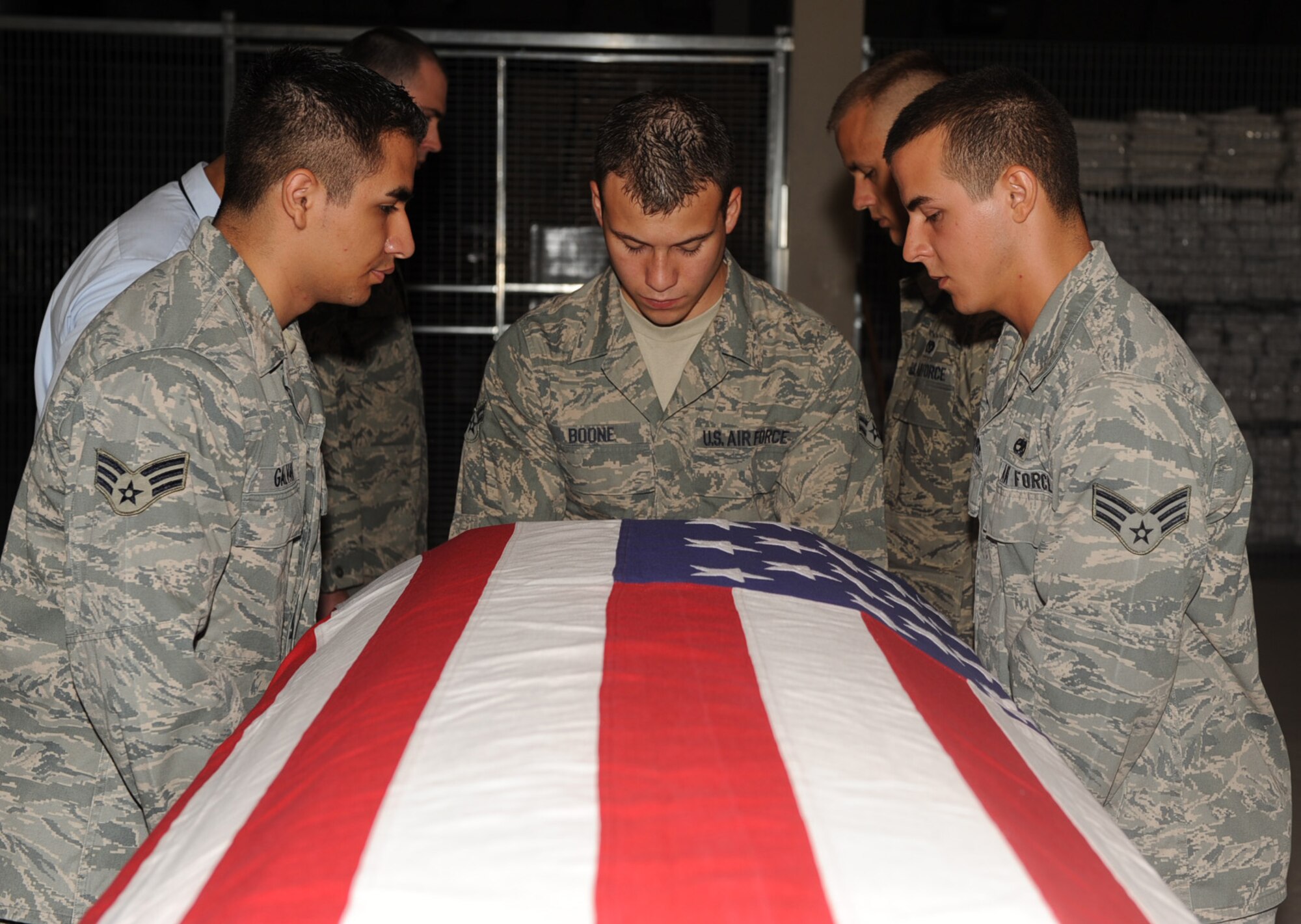 SEYMOUR JOHNSON AIR FORCE BASE, N.C. -- Members of the base Honor Guard carry a mock casket during funeral honors training here June 29, 2010. The Honor Guard team consists of 44 Airmen who represent the Air Force during events of joy and sorrow on and off-base. (U.S. Air Force photo/Senior Airman Gino Reyes)
