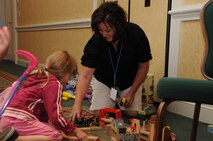 The Yellow Ribbon Reintegration event offers something for everyone. Professional babysitters entertain children, while military members and spouses attend briefing sessions. (USAF photo by SSgt. Terrica Jones, 916ARW/PA)