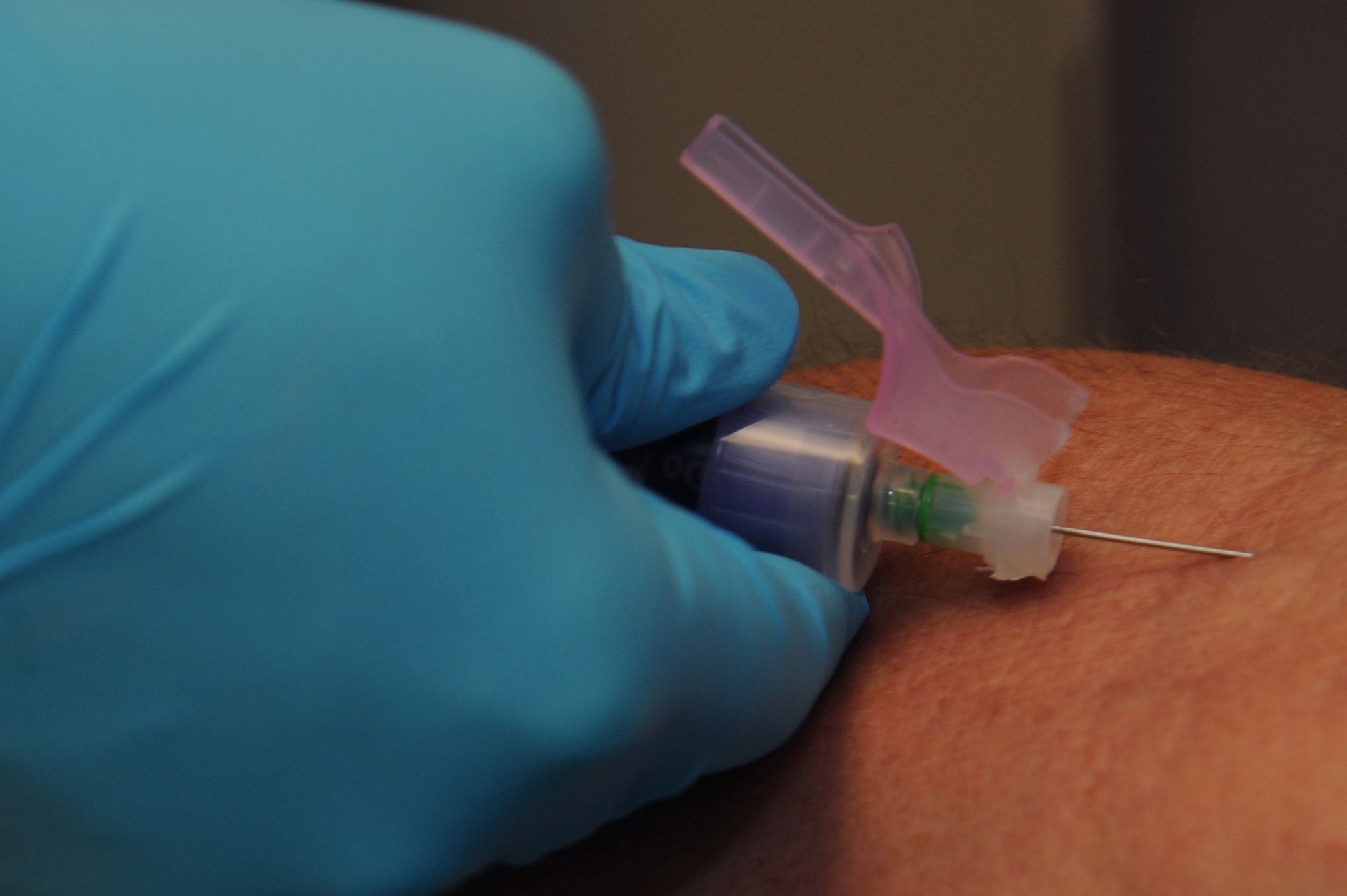 WHITEMAN AIR FORCE BASE, Mo., -- Airman1st Class Erin Hughes, clinical laboratory technician, draws blood from a patient during a routine check-up. (U.S. Air Force photo/Staff Sgt. Jason Huddleston)