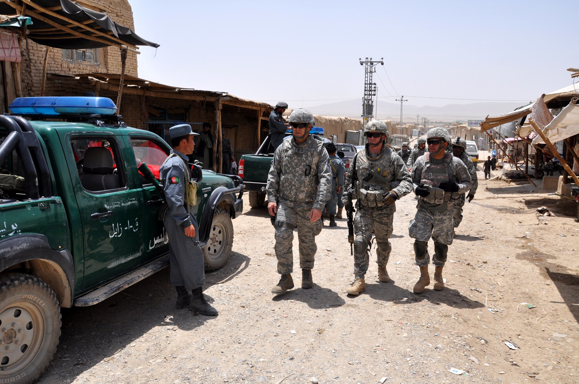 Chief Master Sgt. of the Air Force James A. Roy is accompanied by Lt. Col. Erik Goepner, commander, Zabul Provincial Reconstruction Team as they visit local merchants in Qalat, Zabul province, Afghanistan, during a visit June 27.  (U.S. Air Force photo by Tech. Sgt. Renni Thornton/Released)