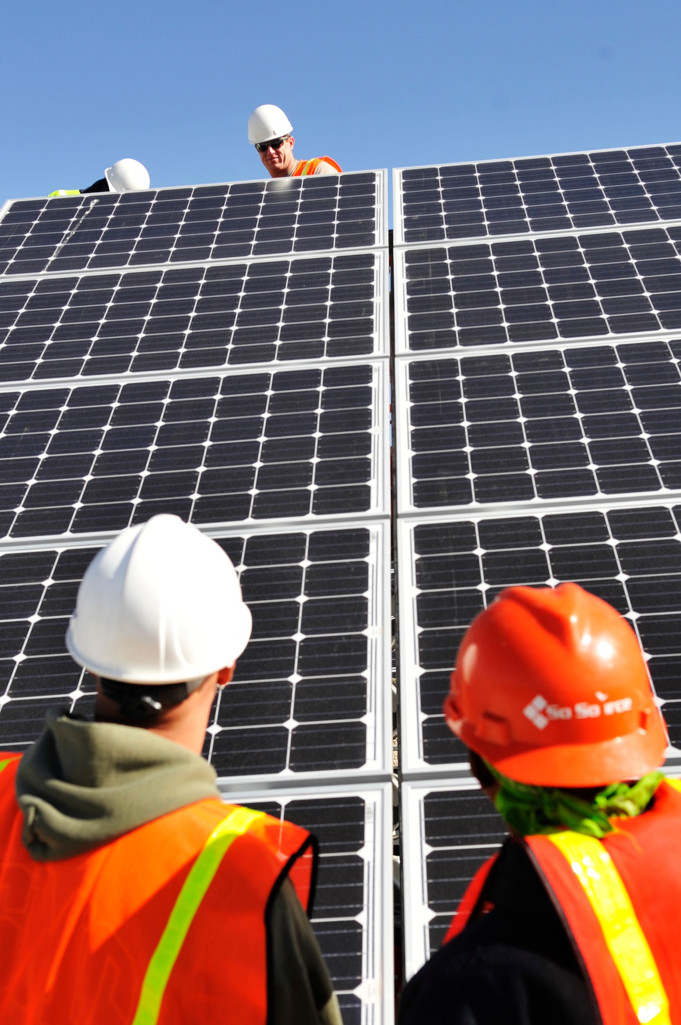 BUCKLEY AIR FORCE BASE, Colo. -- Workers install solar panels at Buckley Air Force Base May 24, 2010. Buckley Air Force Base is installing 5,040 solar panels over six acres on the base to meet the Air Force’s mandate on renewable energy. (U.S. Air Force photo by Airman 1st Class Paul Labbe)