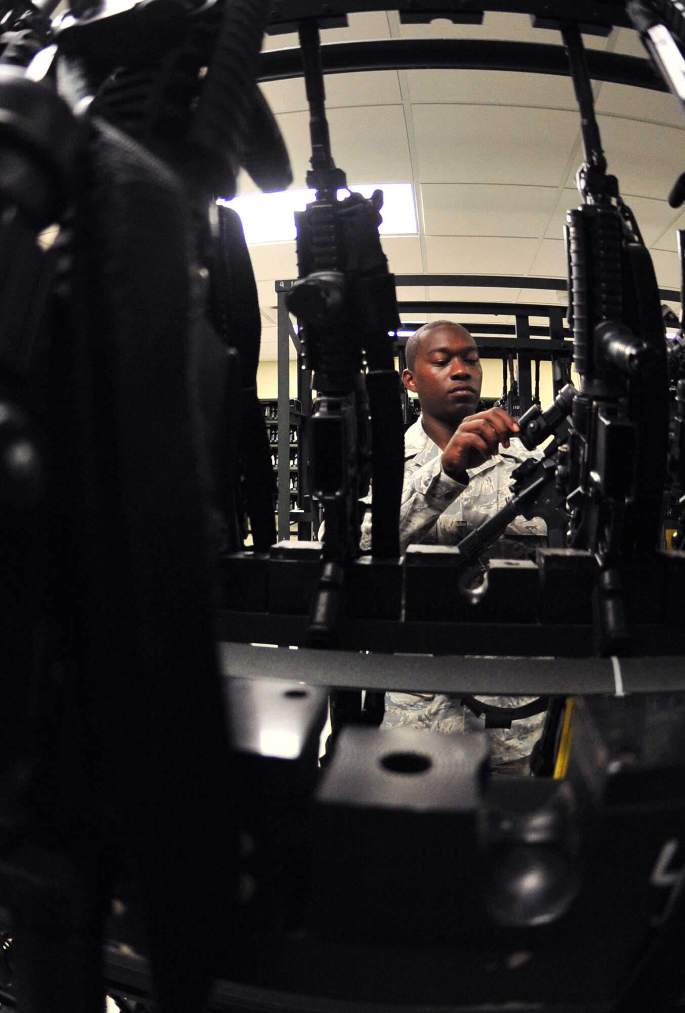 100629-F-8430J-038
Senior Airman Gregory Manora, 20th Security Forces Squadron Flight Armor, checks the inventory during his shift that the base armory June 29, 2010. Airman Manora is responsible for several different jobs in the squadron including the armory, patrolling, checking buildings and chow relief for other 20th SFS Airmen. (U.S. Air Force photo/Airman 1st Class Amber E. N. Jacobs)