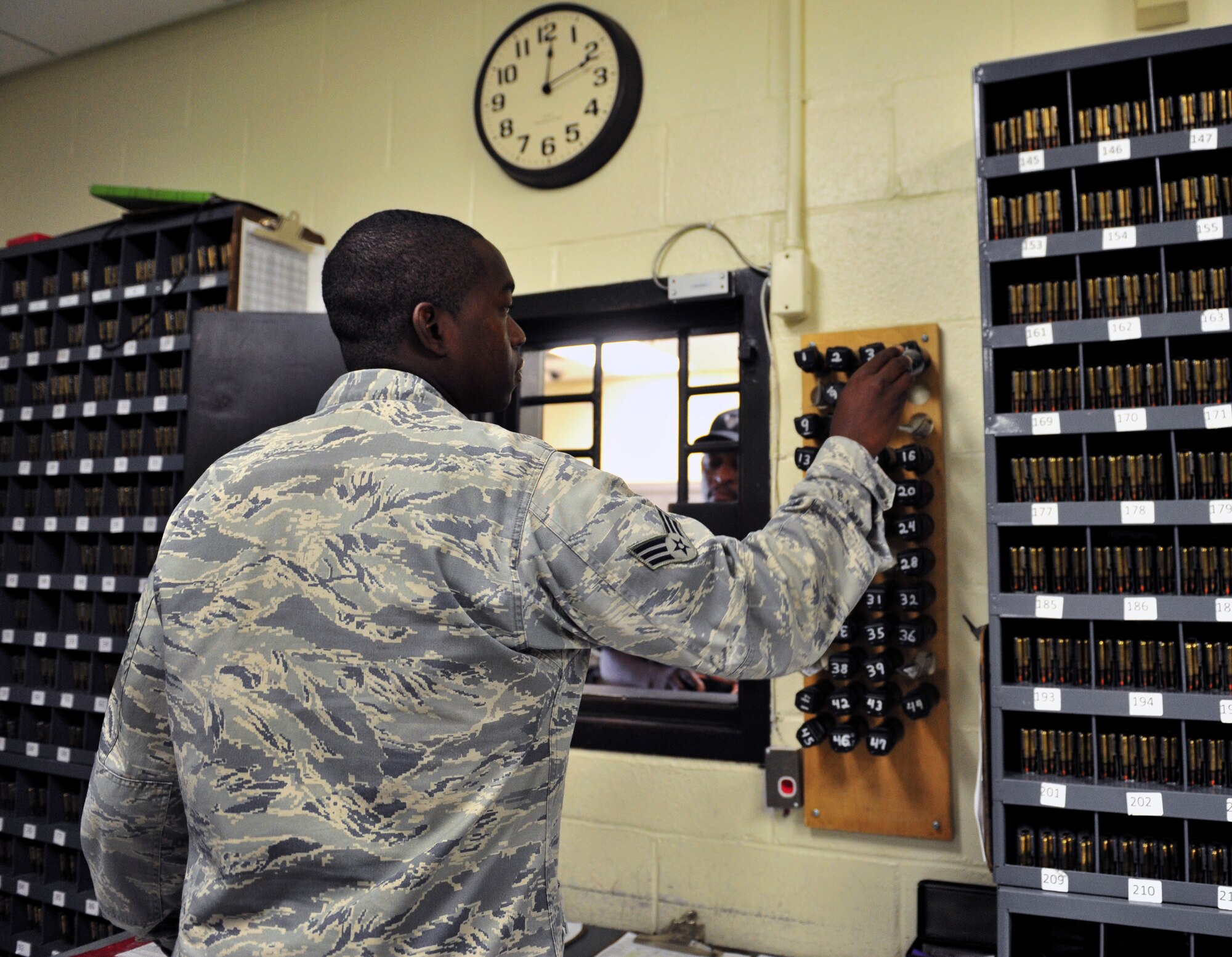 100629-F-8430J-015
Senior Airman Gregory Manora, 20th Security Forces Squadron Flight Armor, issues out equipment to a member of Security Forces at the base armory June 29, 2010. Airman Manora is responsible for several different jobs in the squadron including the armory, patrolling, checking buildings and chow relief for other 20th SFS Airmen. (U.S. Air Force photo/Airman 1st Class Amber E. N. Jacobs)