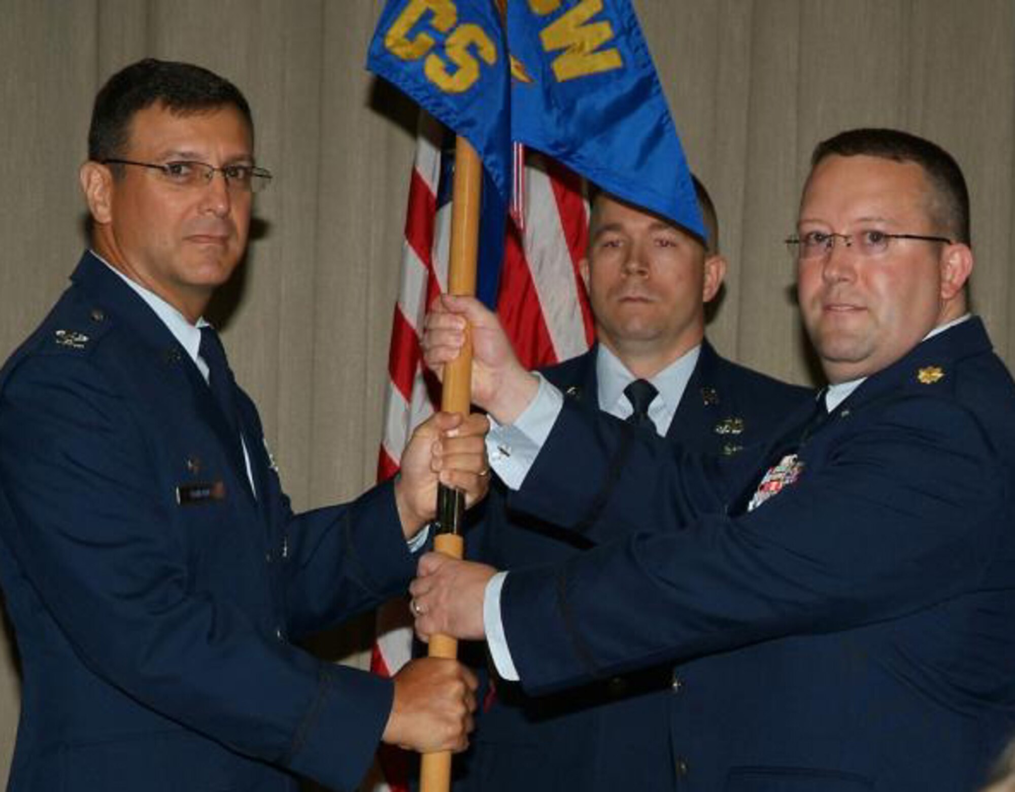 Maj. Lanny Greenbaum (right), 505th Communications Squadron, accepts the squadron’s guidon from 505th Training Group Commander Col. Christopher P. DiNenna during a change of command ceremony held June 4 at Hurlburt Field, Fla. Major Greenbaum was serving as the Global Cyberspace Integration Center Operations Division deputy chief and assumed command from Lt. Col. Keith Muller. The squadron provides state-of-the-art command and control (C2) systems supporting activities and serving the evolving needs of the C2 Warfighter. The squadron's two flights establish multiple networks and provide multiple modeling and simulation capabilities in support of global joint and coalition exercises in addition to training and testing systems at Hurlburt Field and Nellis Air Force Base, Nev. (U.S. Air Force photo by Keith Keel)