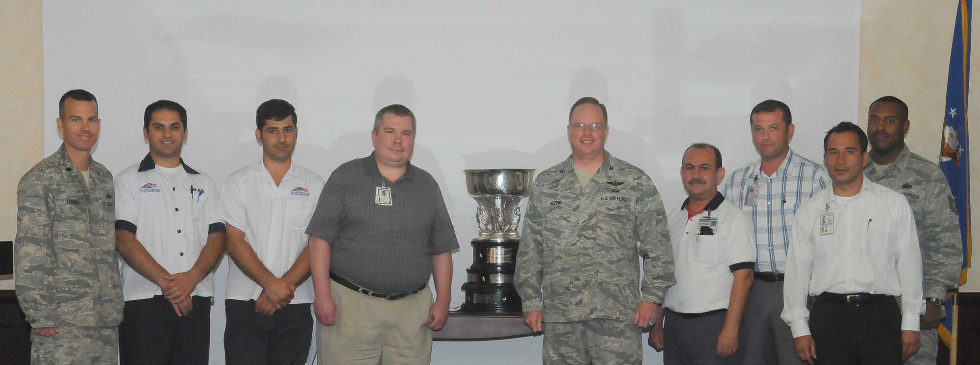 Col Eric Beene, 39th Air Base commander, accepts the Hennessy Award along with the Sultan’s Inn staff members Tuesday, June 30, 2010 at Incirlik Air Base Incirlik, Turkey.   The Hennessy Award program, established in 1956, is an annual competition to determine the best food service program in the Air Force. The award's name honors John Lawrence Hennessy, a hotel and restaurant executive who led a special commission task group to improve military food service. (U.S. Air Force photo/Senior Airman Alexandre Montes)