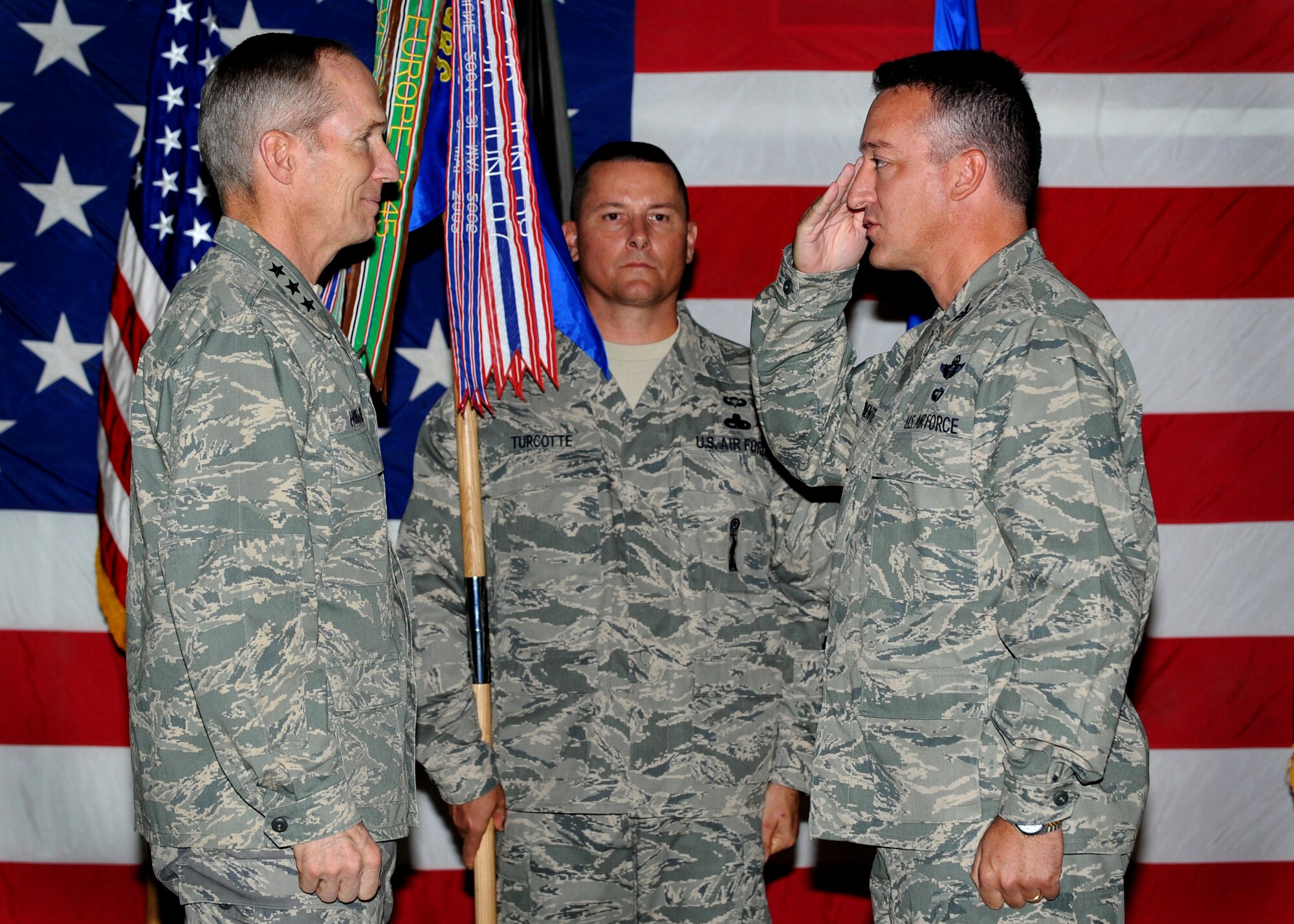 SOUTHWEST ASIA - Lt. Gen. Mike Hostage (left), commander, U.S. Air Forces Central Command, returns a salute to Col. Patrick Mordente, the new 386th Air Expeditionary Wing commander, during a change-of-command ceremony here June 30, 2010, at the base passenger terminal. Colonel Mordente assumed command after Col. John Gordy II relinquished command. (U.S. Air Force photo by Senior Airman Laura Turner/Released)