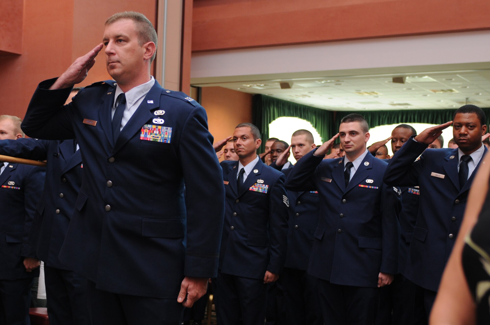 Lt. Col. Raymond R. Newbill and a 31st Communications Squadron formation salute  during the squadron's change of command ceremony June 29 at the La Bella Vista Club. Prior to his assignment at Aviano, Colonel Newbill was the Executive Officer, Director of Operational Capability Requirements, Operations, Plans and Requirements, Headquarters U.S. Air Force at Washington, D.C. (U.S. Air Force photo/ Staff Sgt. Nadine Y. Barclay)