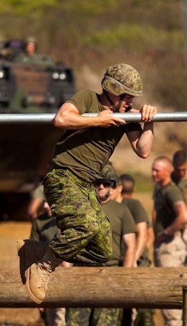 A soldier assigned to Company G, 2nd Battalion, The Royal Canadian Regiment, Canadian Army, executes the first portion of the O-Course at Landing Zone Boondocker on Marine Corps Base Hawaii June 30. The 2nd RCR soldiers participated in training with Marines from 2nd Battalion, 3rd Marine Regiment, as part of the Exercise Rim of the Pacific 2010, a biennial exercise designed to strengthen regional partnerships and improve bilateral interoperability.