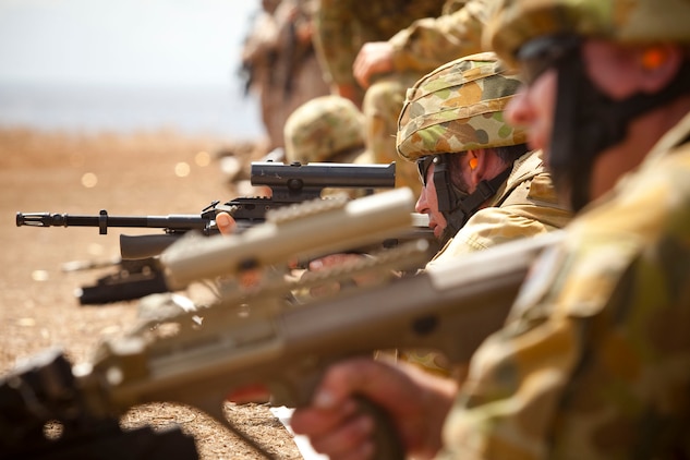 A soldier assigned to Support Company, 2nd Battalion, Royal Australian Regiment, Australian Army, sights in on his F88 Austeyr rifle during a battle sight zero exercise at the Marine Corps Base Hawaii Range Training Facility June 30. Service members from Australia, Canada, Indonesia, Malaysia and Tonga joined Marines with 2nd Battalion, 3rd Marine Regiment in training as part of the Exercise Rim of the Pacific 2010, a biennial exercise designed to strengthen regional partnerships and improve bilateral interoperability.